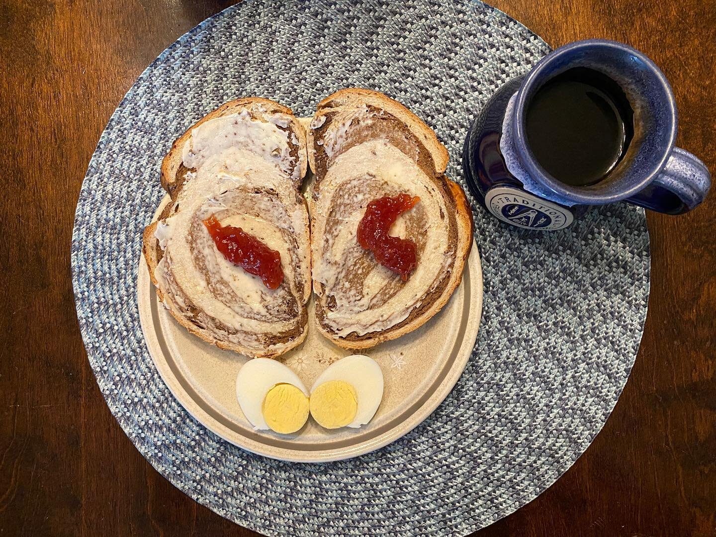 #hobbitday2022 
Breakfast: marbled rye bread with butter and strawberry preserves with a hard boiled egg and black coffee. 
#eatlikeahobbit
