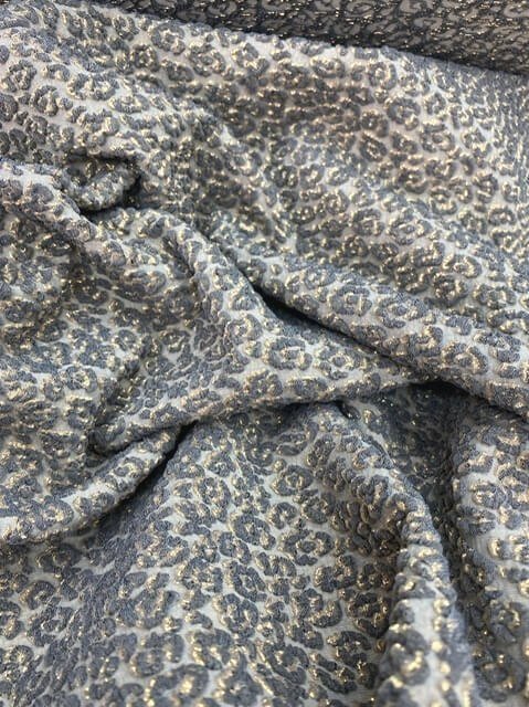 Bi stretch brocade fabric coupon with grey and gold leopard motifs