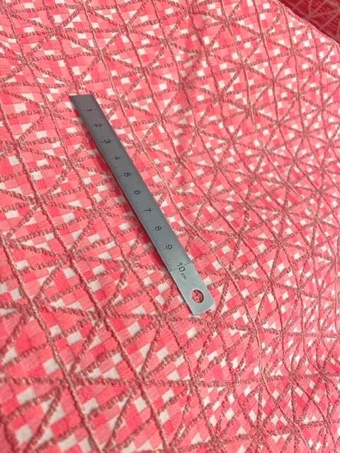 Coral and vanilla bi-stretch jacquard fabric coupon with diamond pattern - measurements