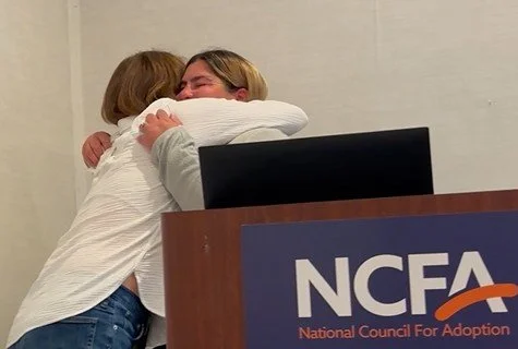 Justine Kelly hug.jpg