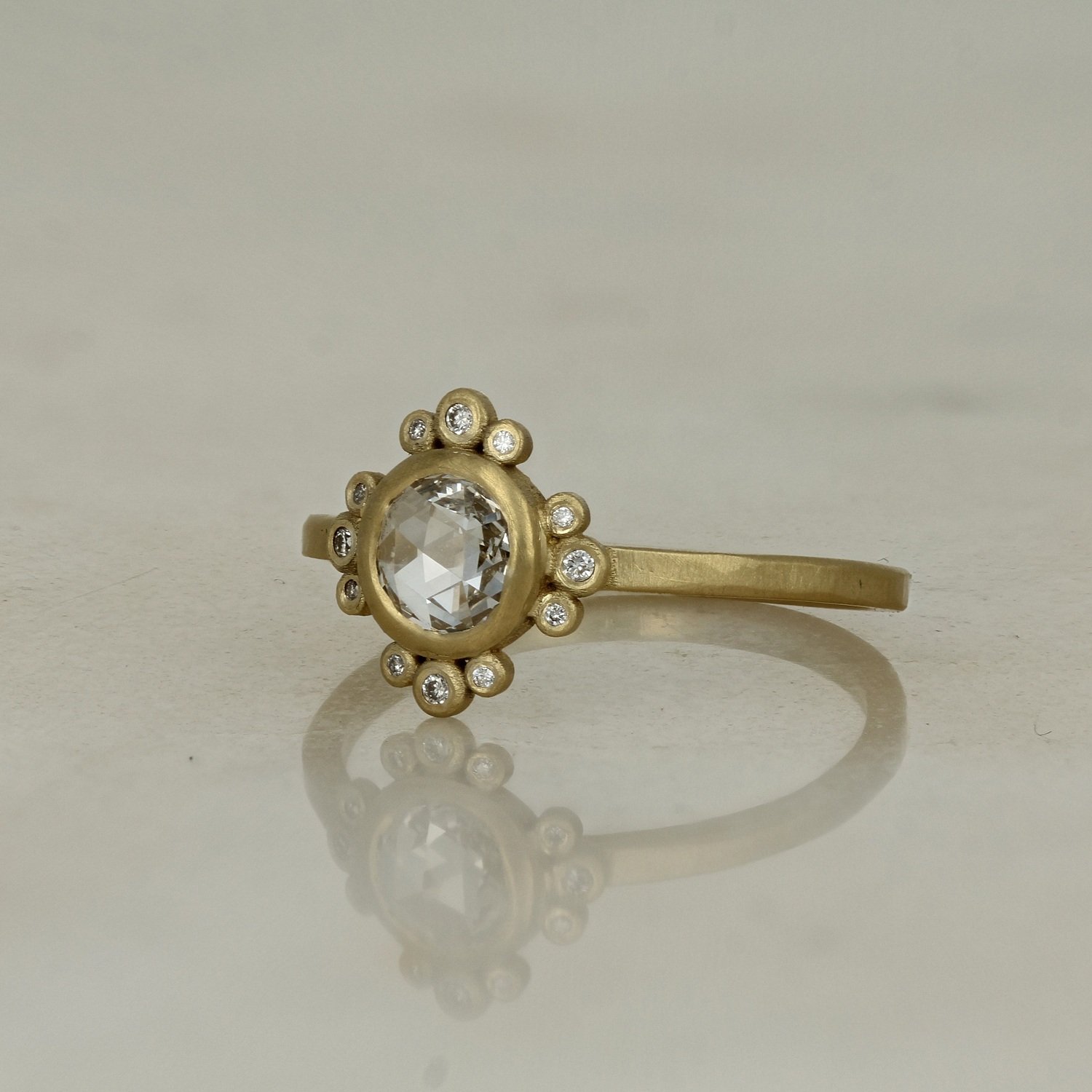 18k brushed finish yellow gold rose cut bezel set diamond accented engagement ring
