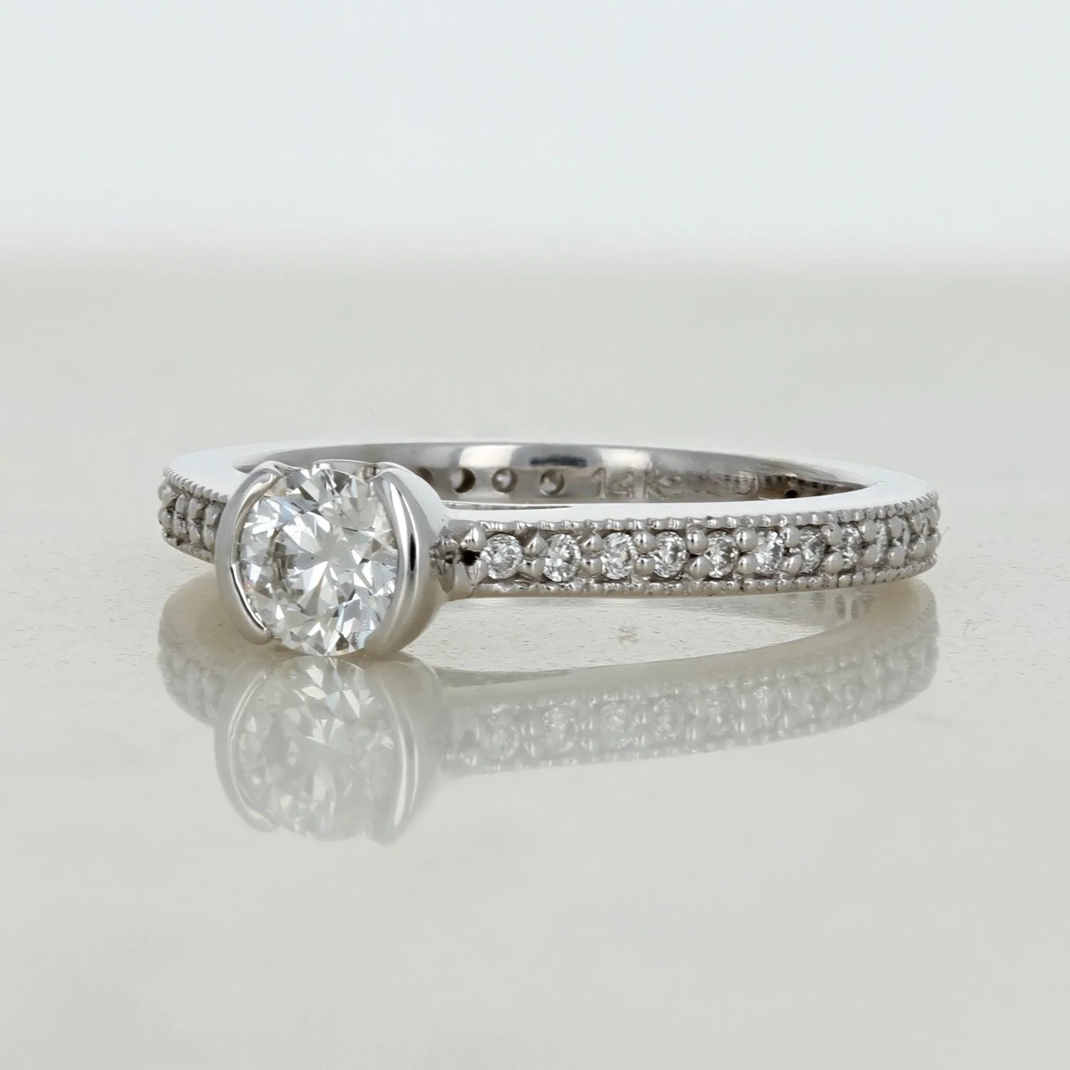 14k white gold round diamond bezel set accented engagement ring