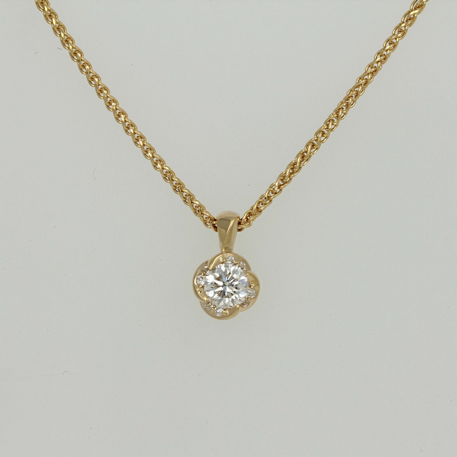 18k certified Canadian yellow gold round Canadian diamond wrap twist accented necklace pendant