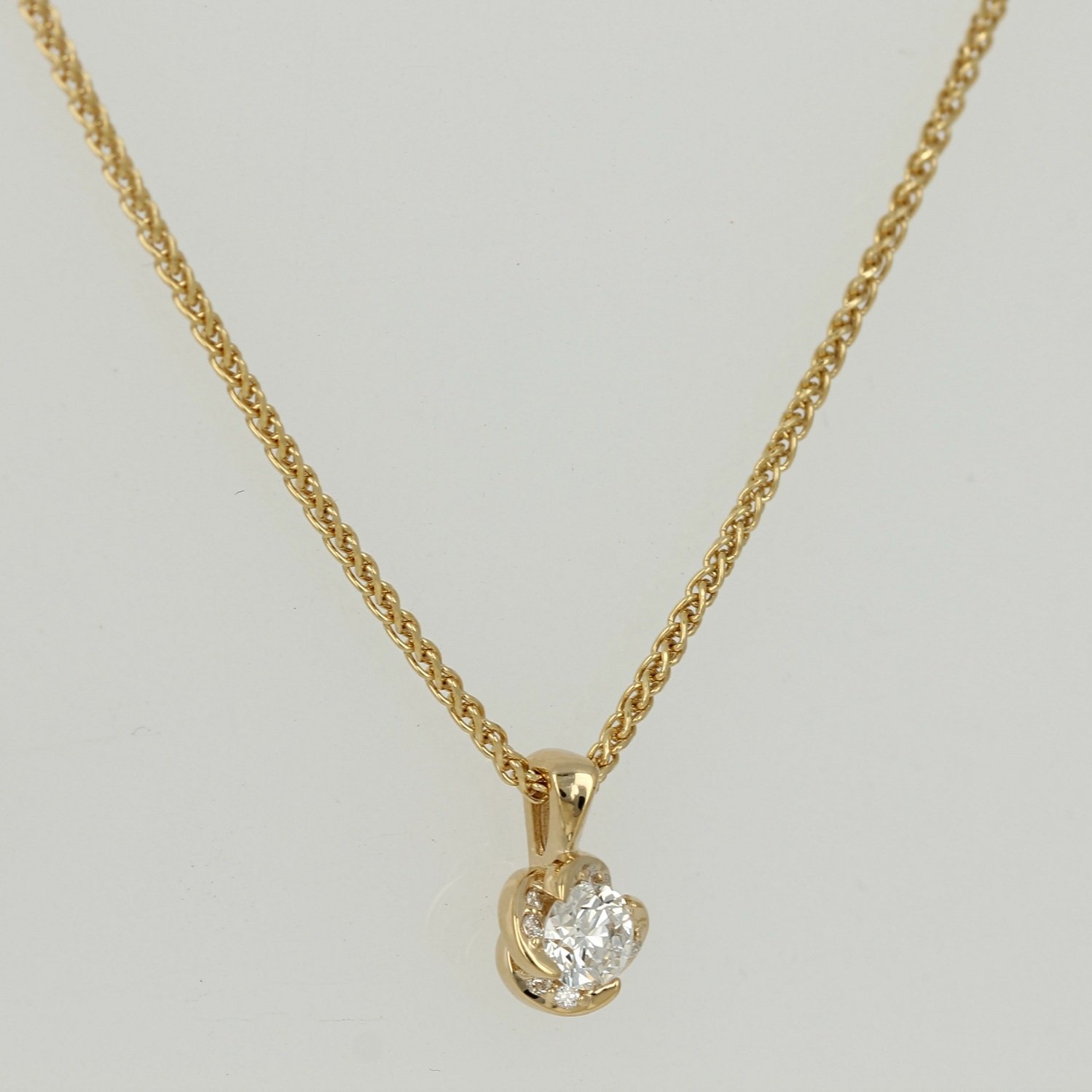 18k certified Canadian yellow gold round Canadian diamond wrap twist accented necklace pendant