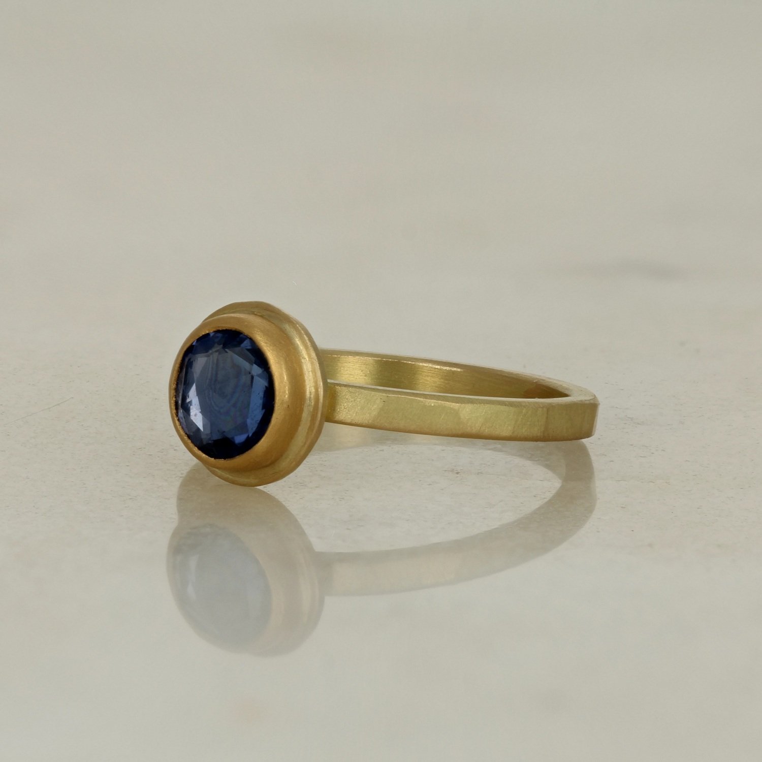 18k & 22k yellow gold with brushed finish bezel set round rose cut blue sapphire engagement ring