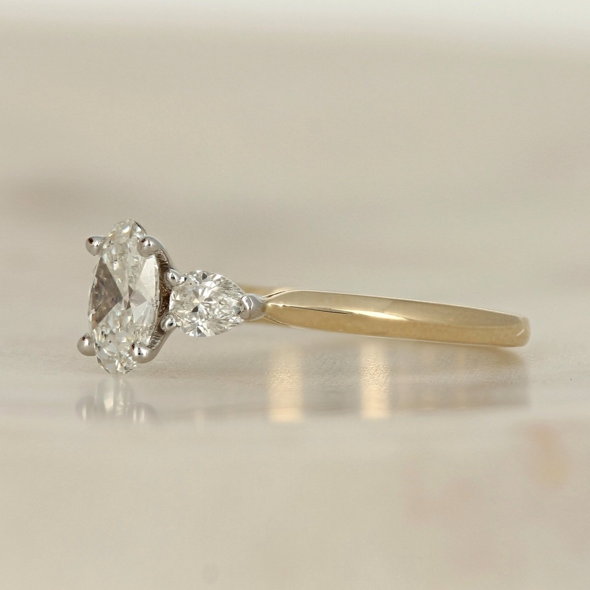 14k two tone yellow white gold oval Canadian diamond accented three stone engagement ring