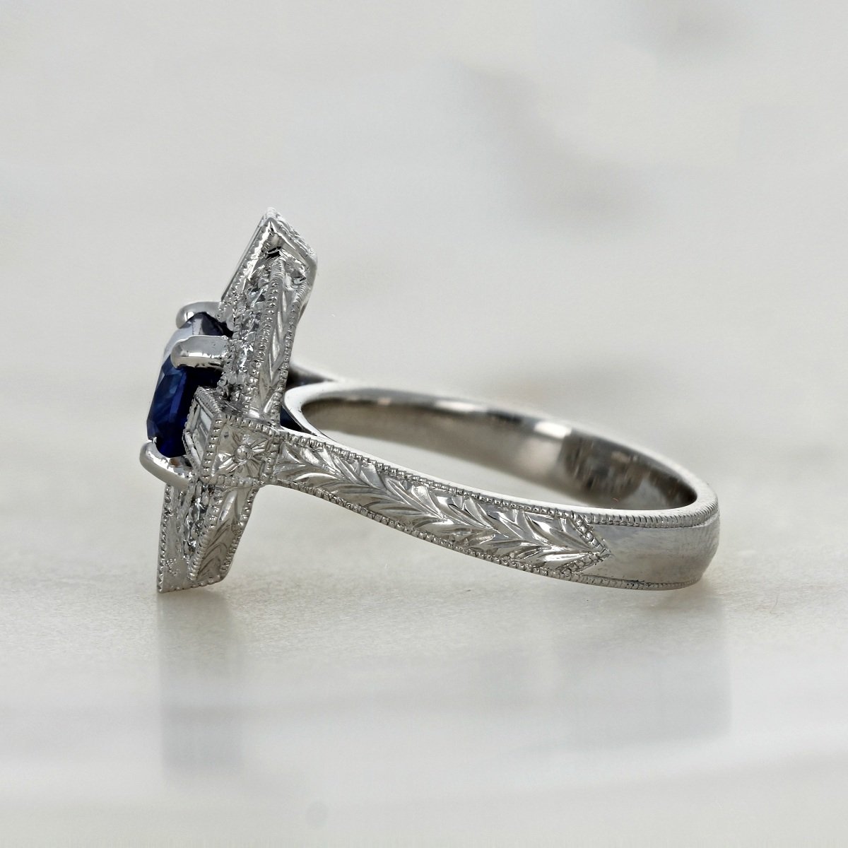 platinum emerald cut sapphire art deco diamond accented ring