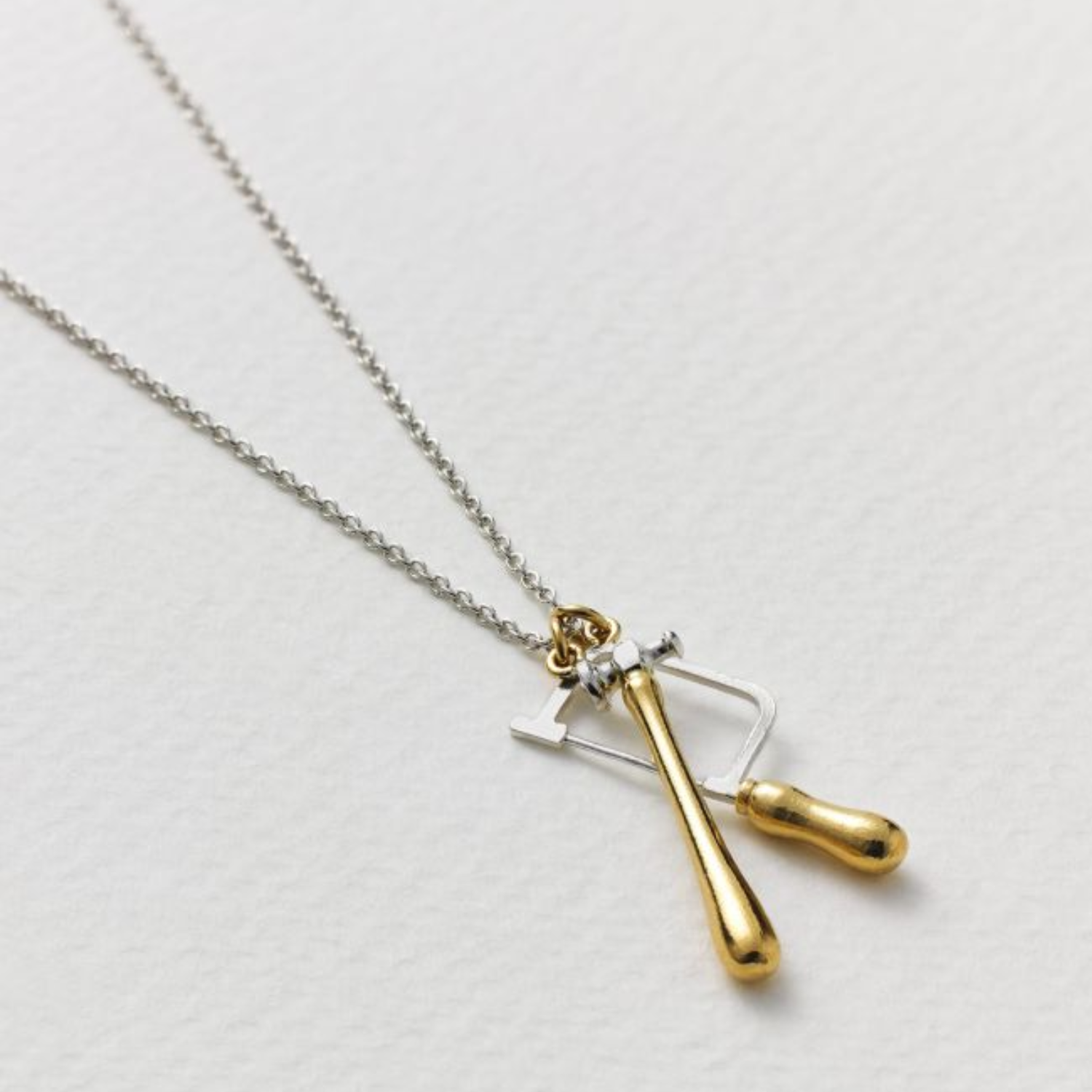 sterling silver two tone gold plated jewellers saw and hammer craft necklace alex monroe