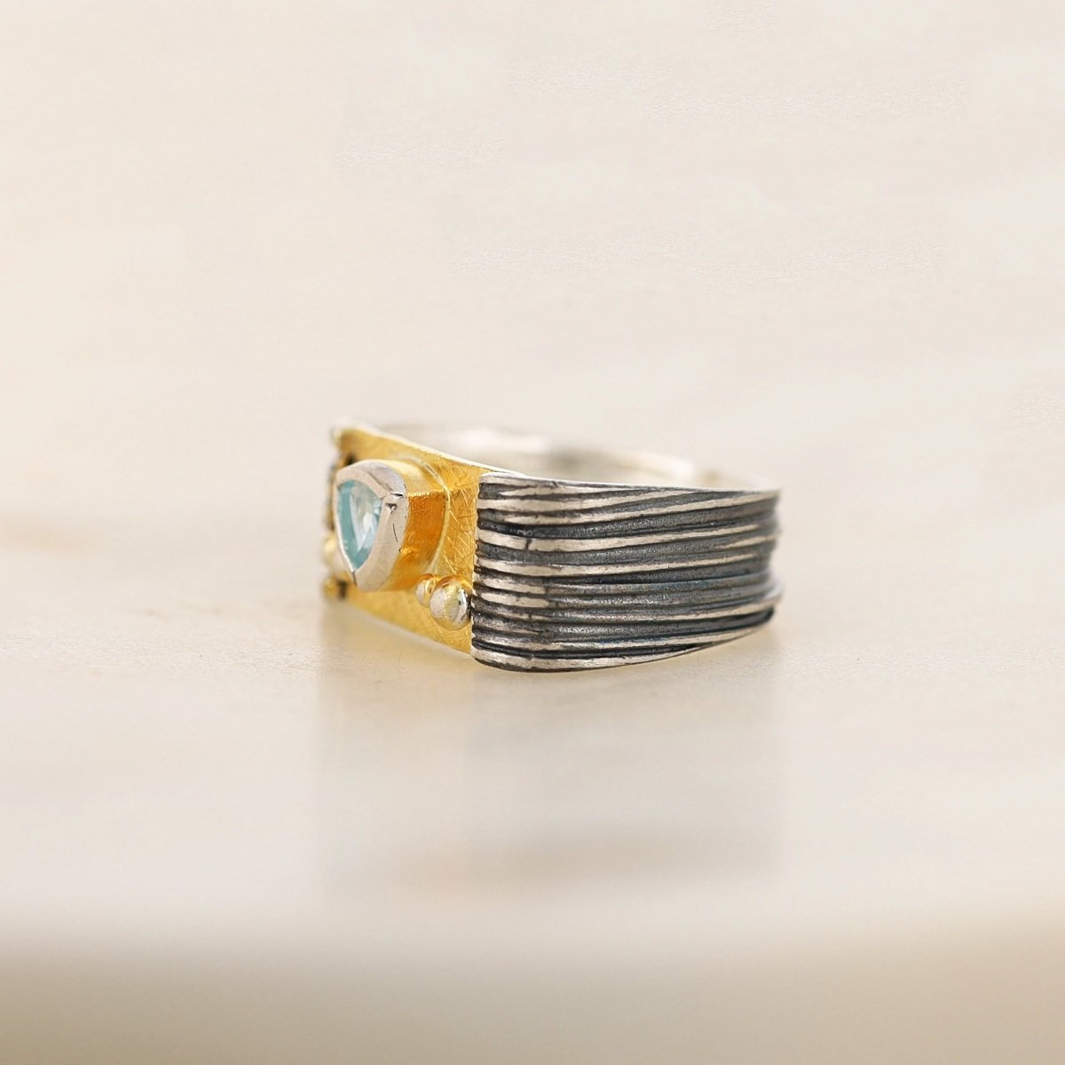oxidized textured sterling silver gold plate trillion blue topaz wide band ring