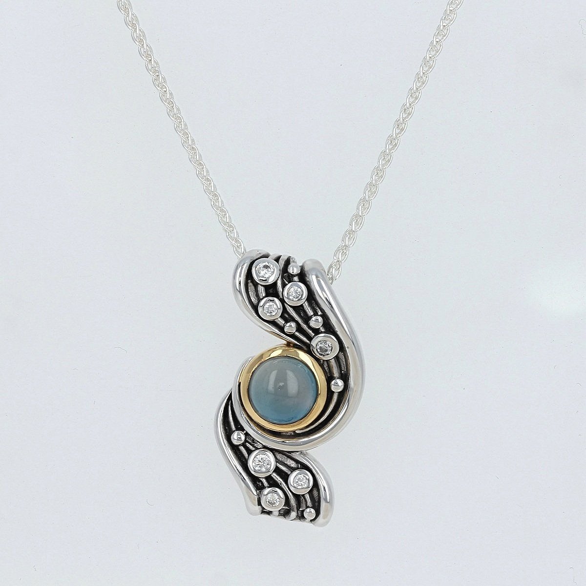oxidized sterling silver yellow gold cabochon blue topaz accent cubic zirconia cz celestial wave pendant necklace