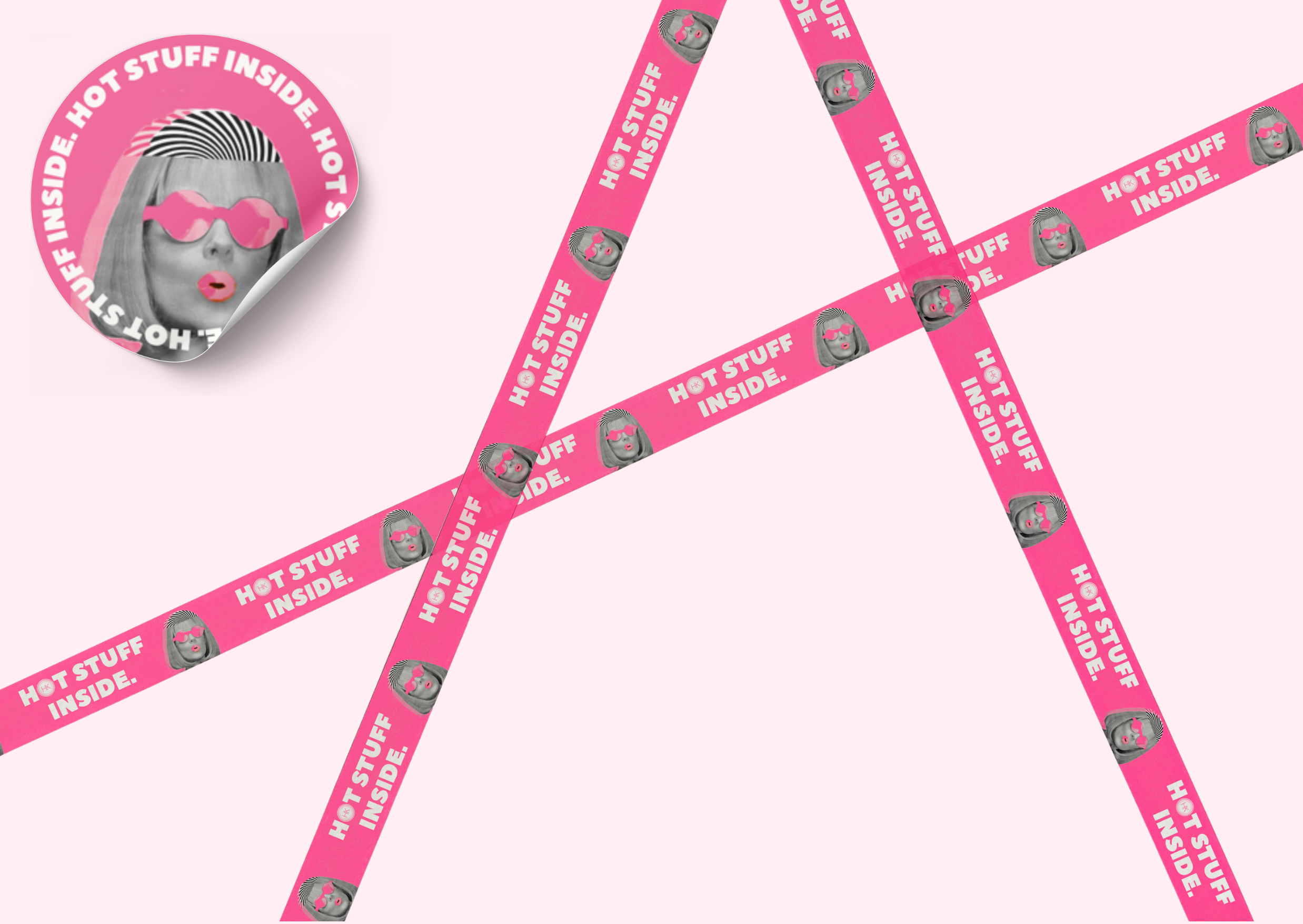 Housekeepers Design pink peel-and-stick tape with a woman's face illustration wearing glasses and the text 'HOT STUFF INSIDE' repeated on it, arranged in a overlapping pattern against a light pink background.