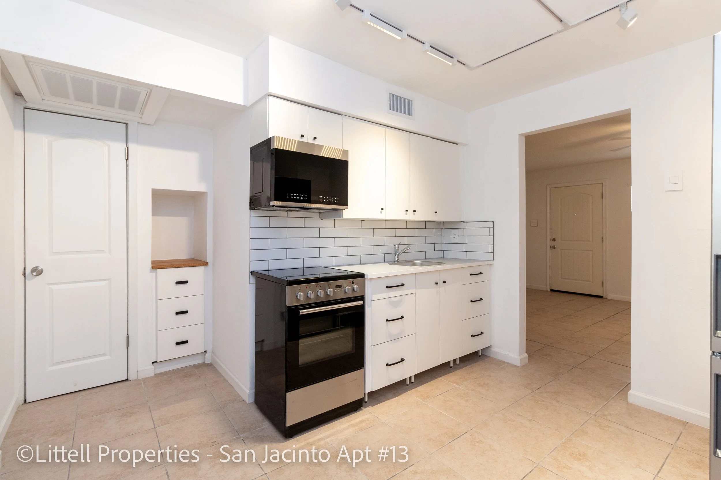  View of kitchen. Kitchen has a pantry and small counter space  