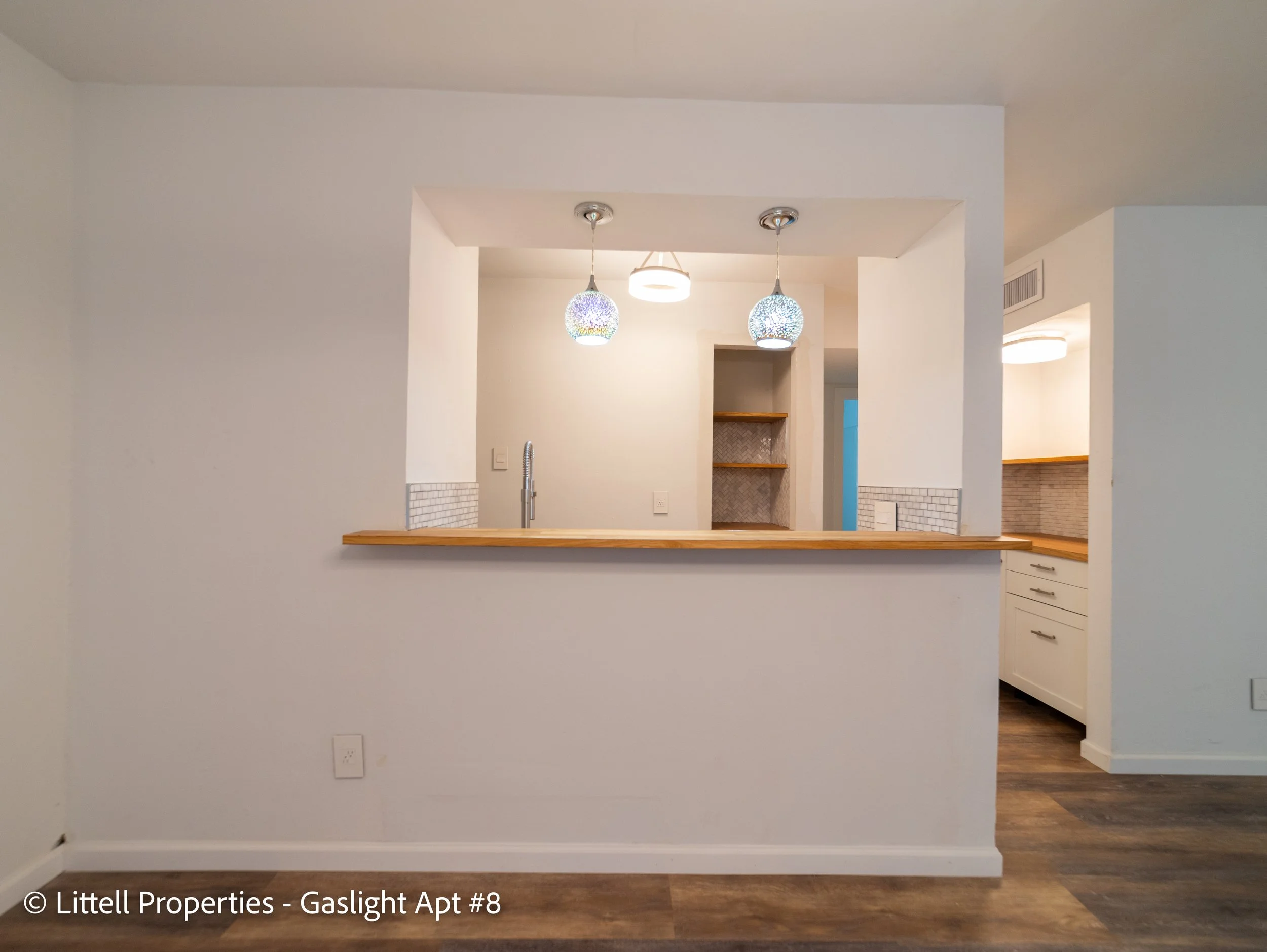  The kitchen has a bar area that looks out into the dining area.  