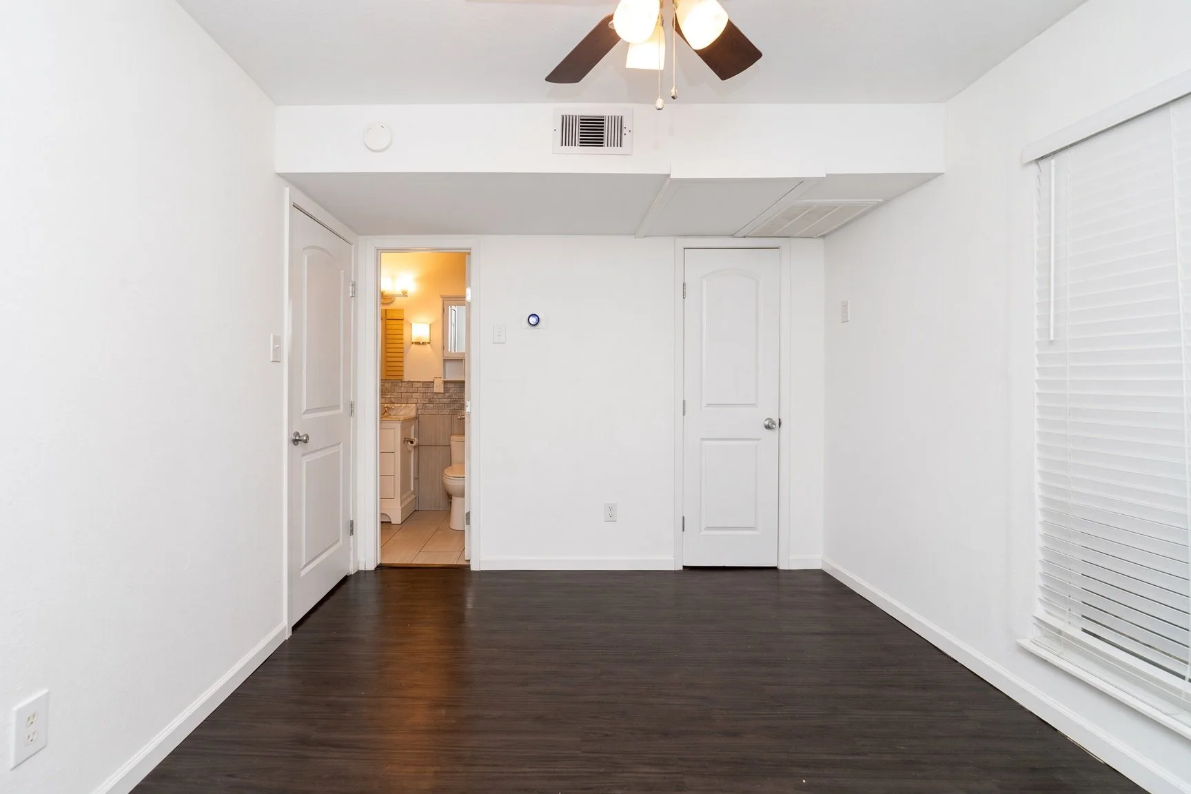  View of the bedroom with entrance to the bathroom and 2 walk-in closets.  