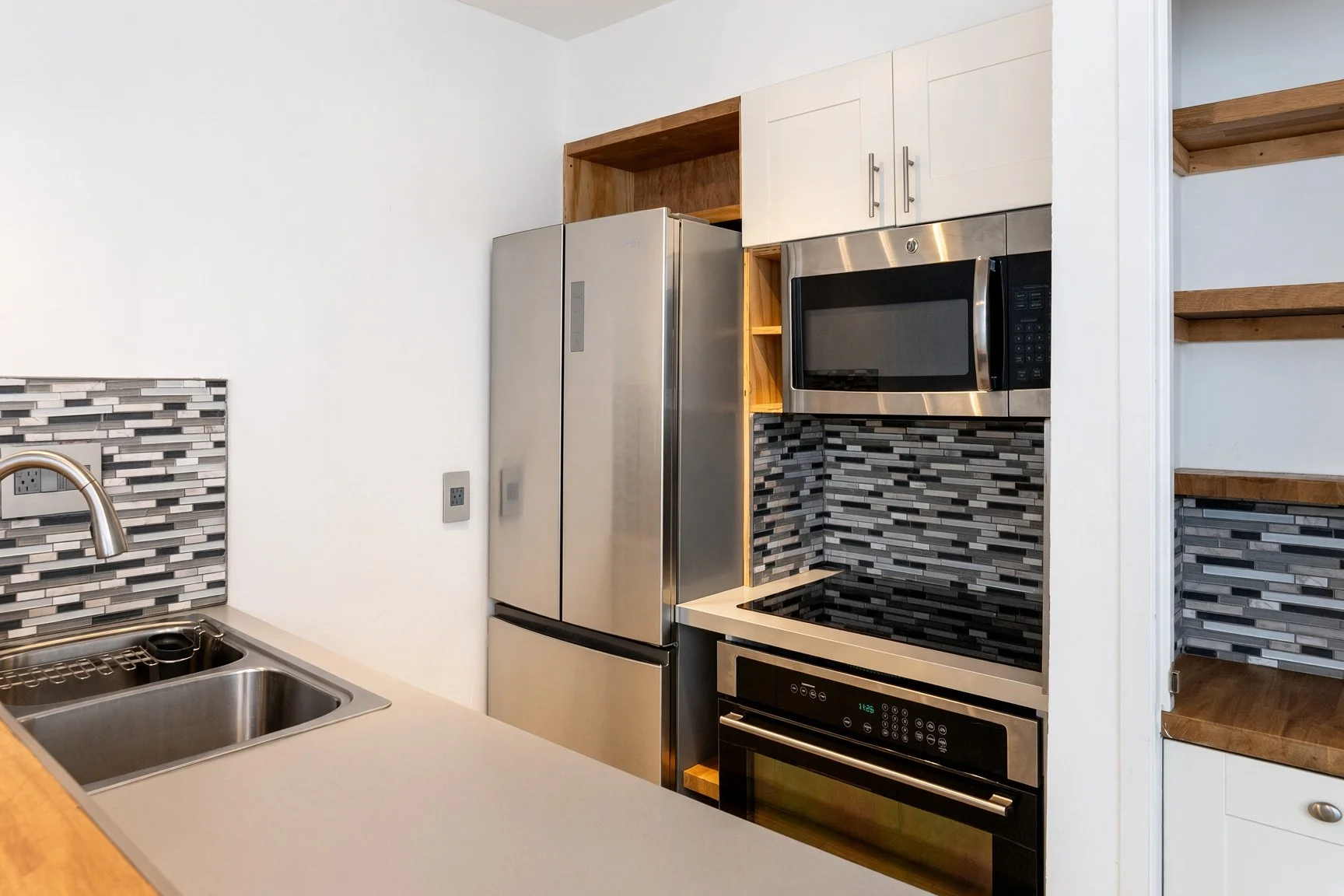  French door refrigerator, built in microwave and electric stove/oven range  