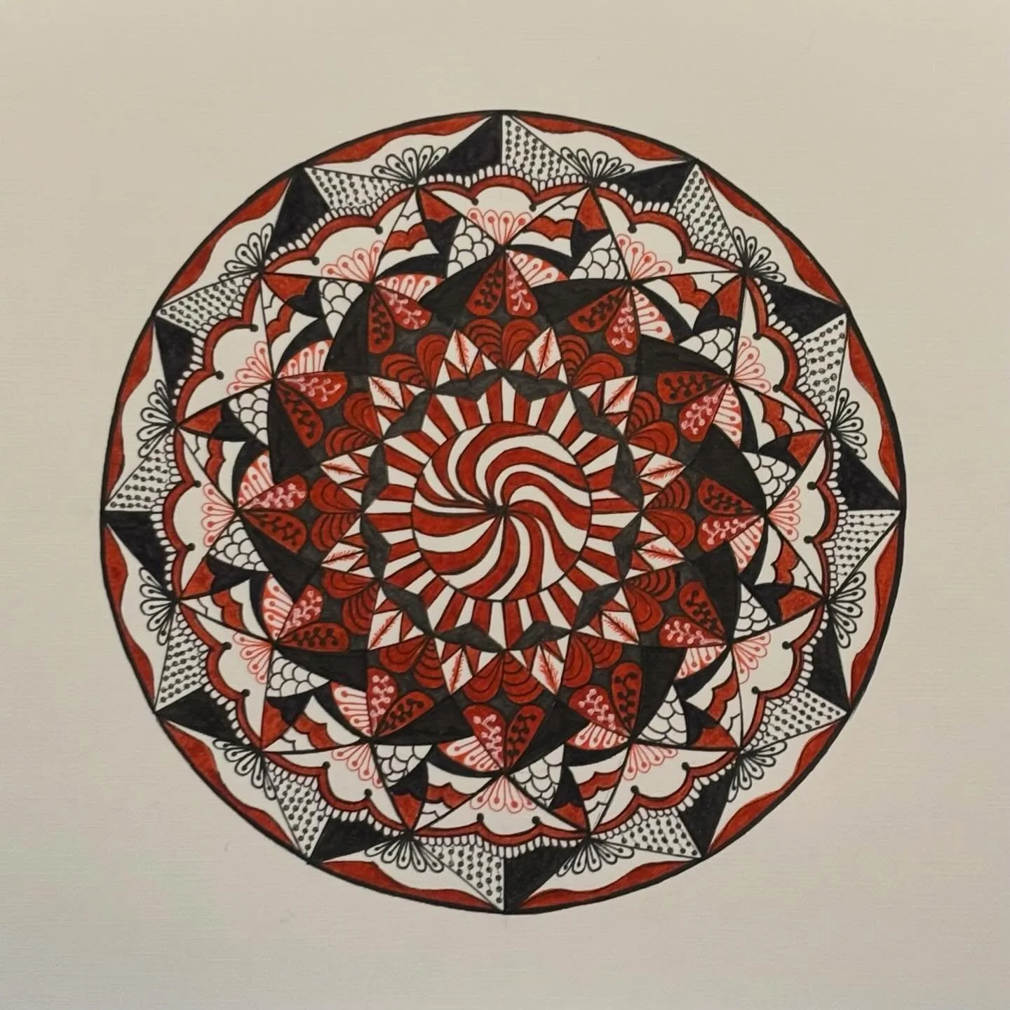 I forgot to share this one a few weeks ago. I like working with red and black - it reminds me of something you would see in a card deck. #femandala #InstaMandala #DailyMandala #MandalasofInstagram #mandalas