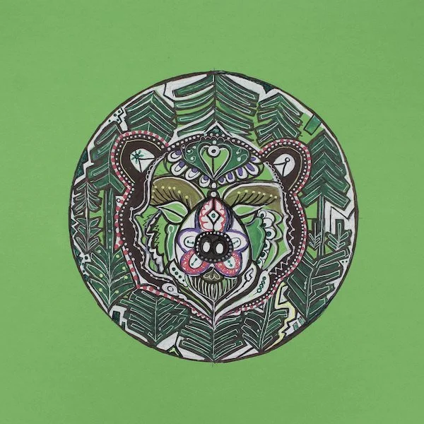 Colorful, intricate drawing of a bear's face surrounded by leafy patterns on a green background.