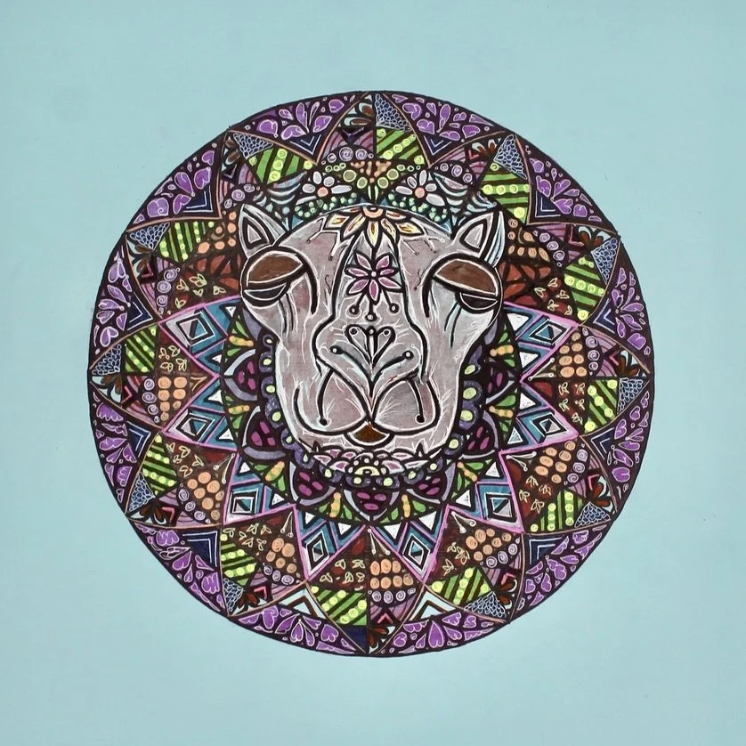 Colorful mandala featuring a line-drawn lion's face at the center, surrounded by intricate geometric patterns and bright colors.