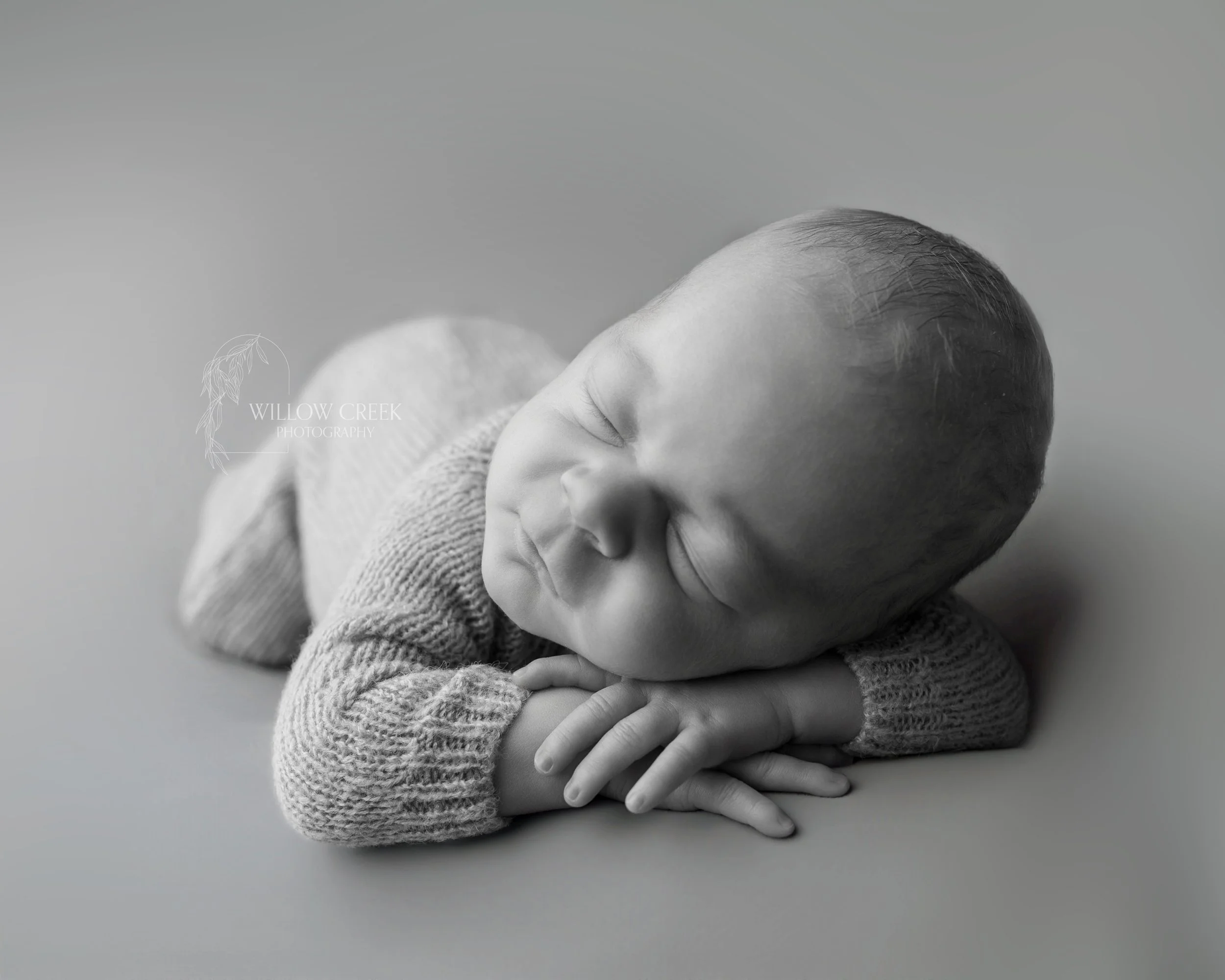 Peaceful newborn portrait during an in-home session