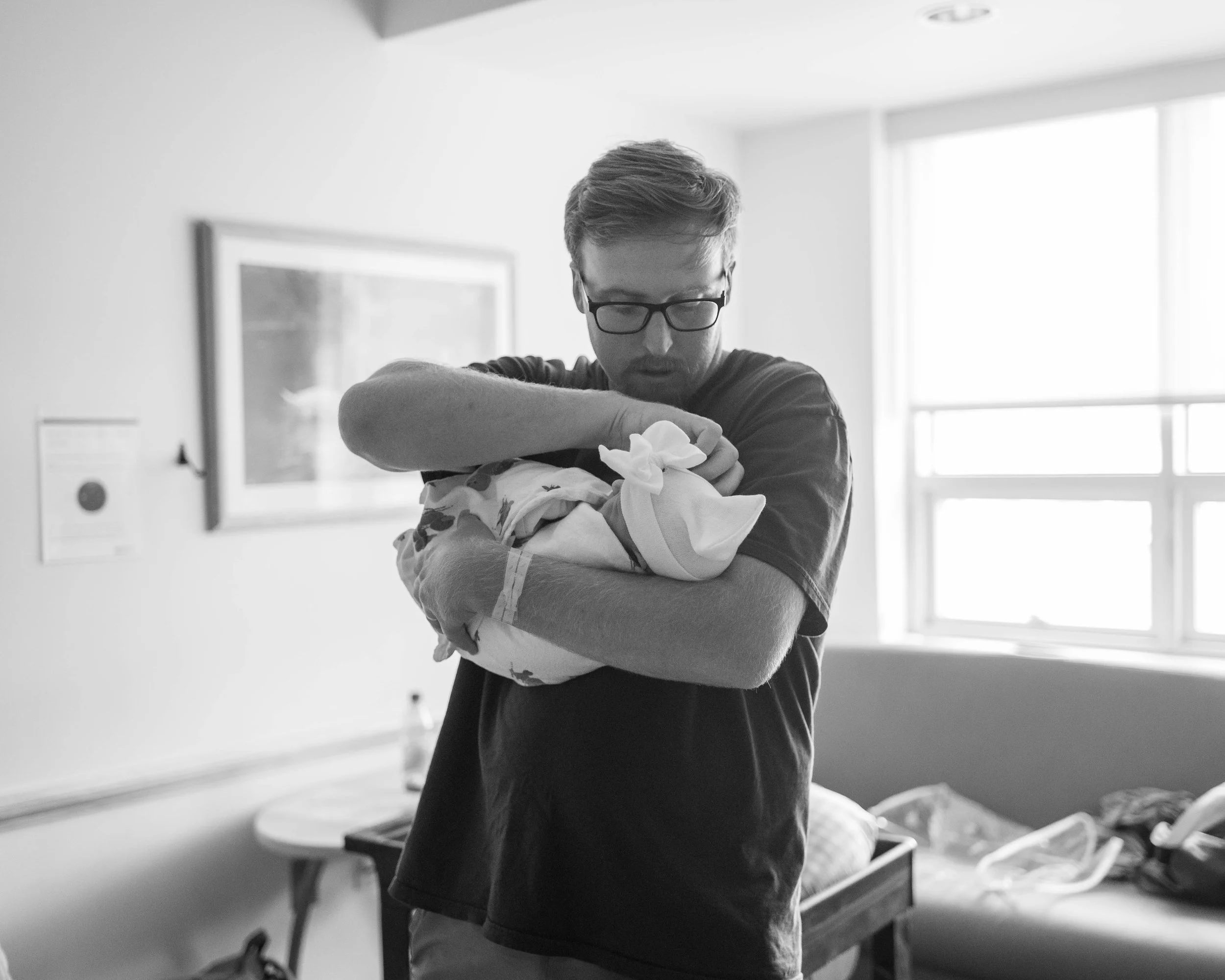 Dad Holding Newborn at Betty H Cameron, Wilmington, NC