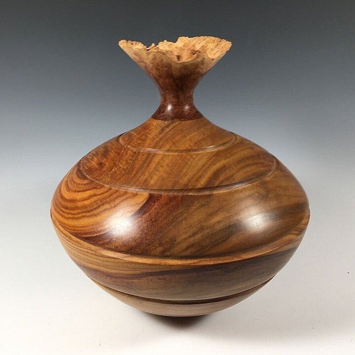 Canary Wood Vessel with Eucalyptus Top
10&rdquo; high by 8&quot; wide

This bowl was turned from Canary Wood, a South American hardwood. The top was turned from Eucalyptus. A wipe on poly finish preserves the wood which can be cleaned with a damp spo