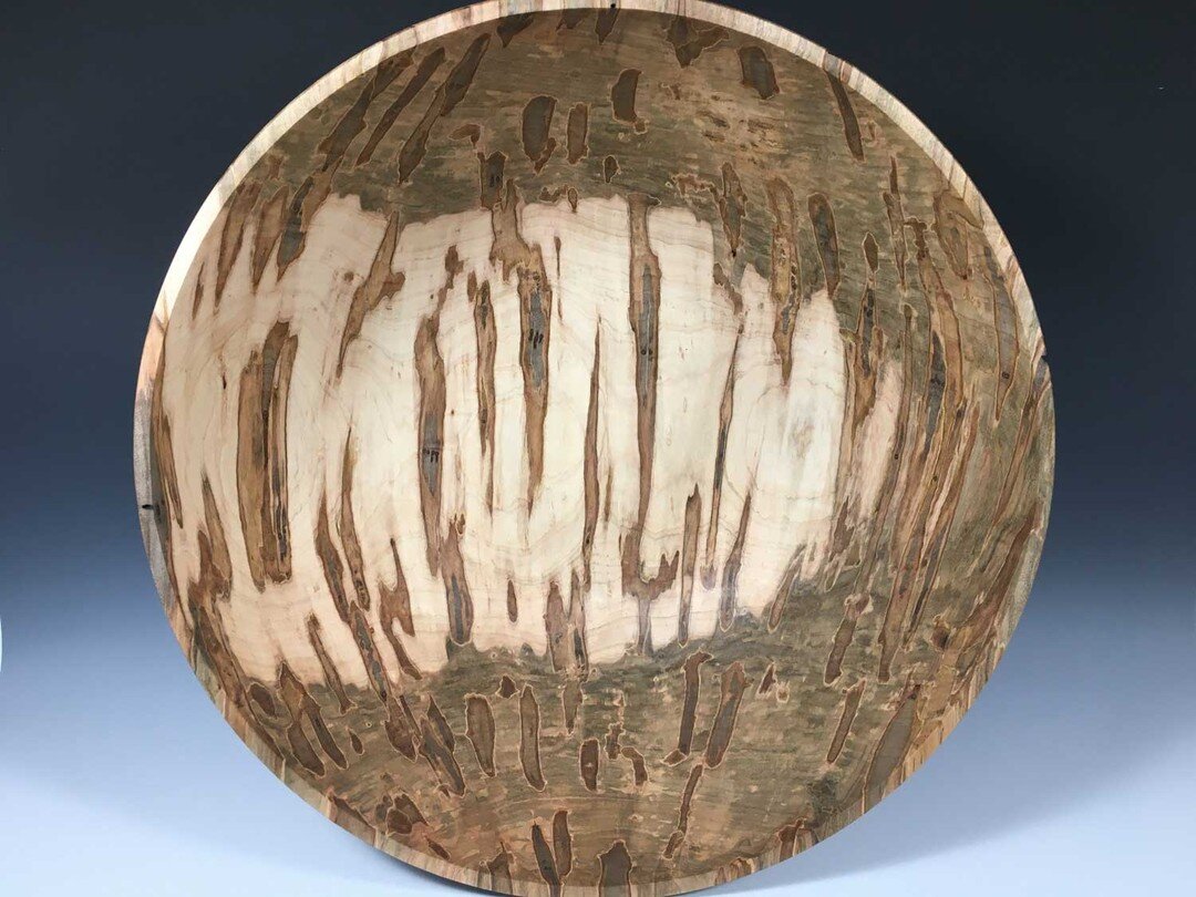 This bowl was turned from Red Maple, a very common Southern hardwood. The many colored streaks were created by the Ambrosia beetle, harmless to the tree, creating a striking pattern in the wood. The bowl is perfect for salads or holding fruit. A food