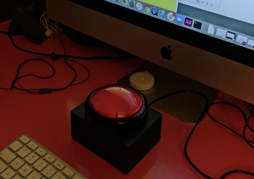 button on orange desk.png