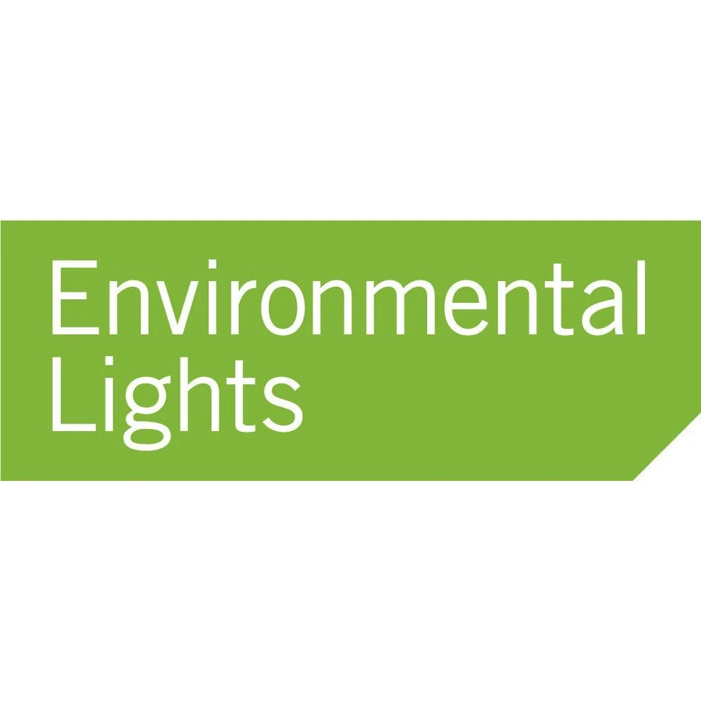 A green sign with white text reading "Environmental Lights".
