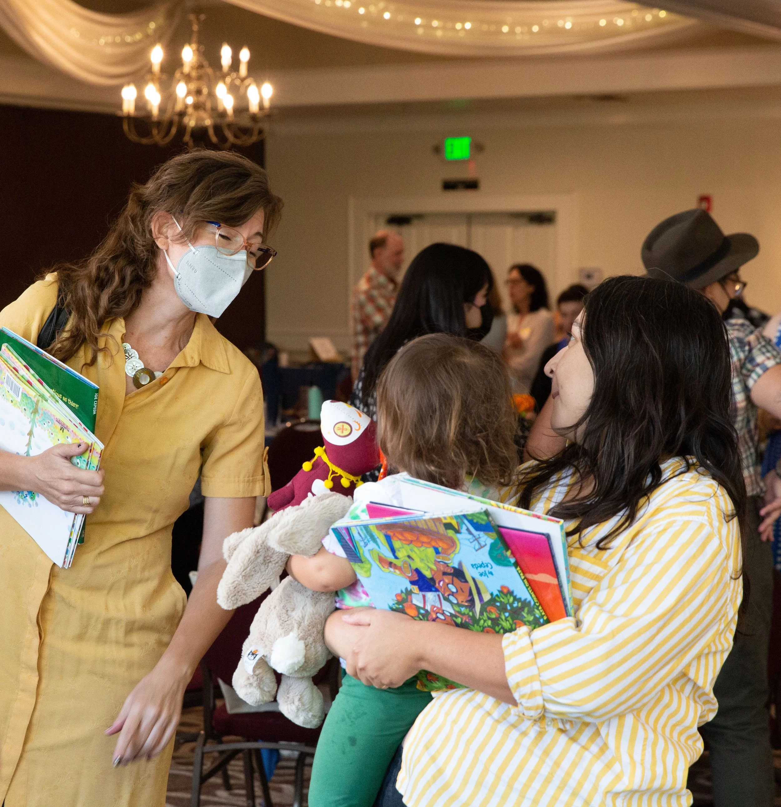 Former CLCSC Board Member Megan Panatier chats with a young guest and their mother at the 2023 CLCSC Awards Ceremony. (Josh Steichmann)