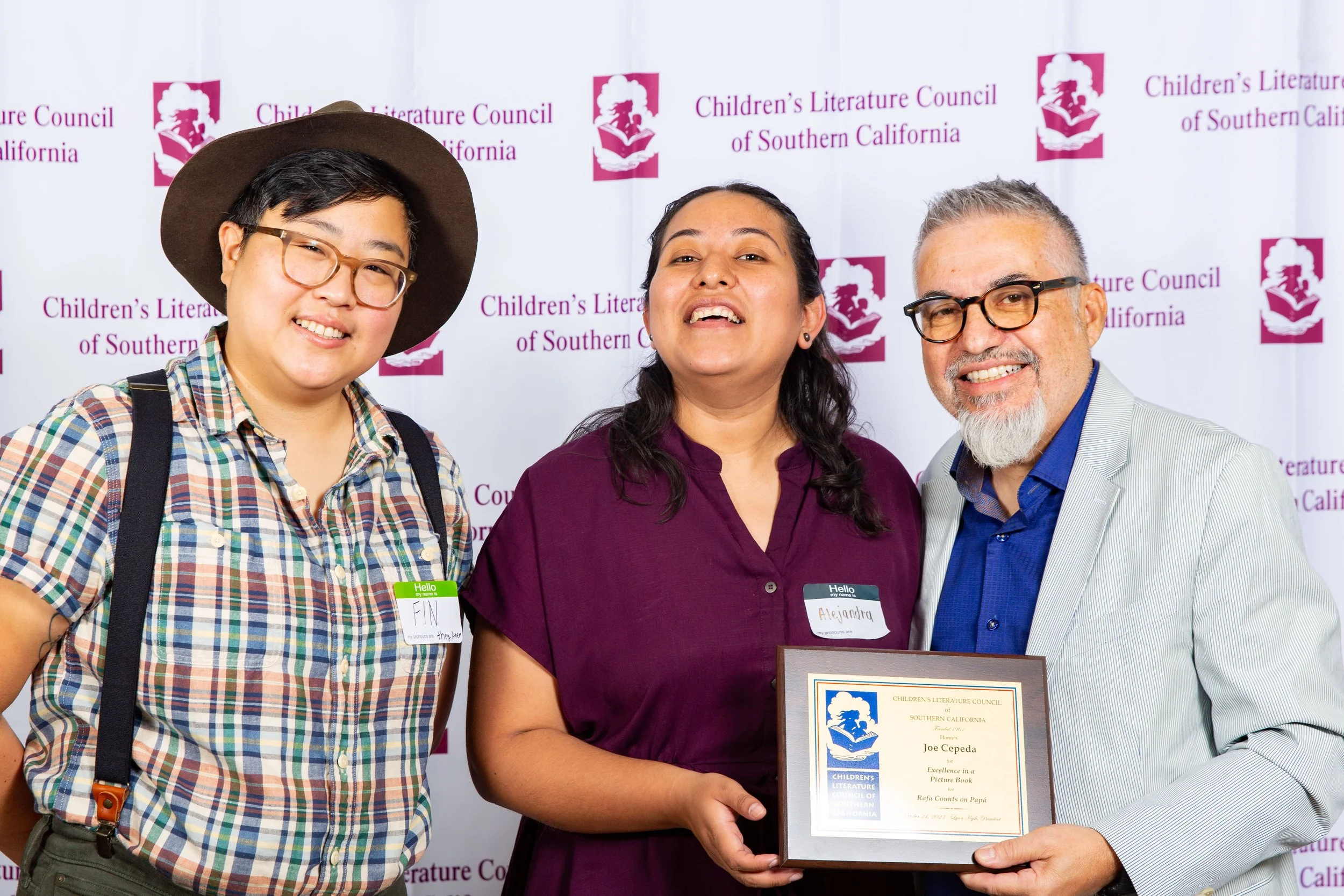 L to R: Awards Committee Chair Fin Lee, Awards Committee Member Alejandra Reyes, and Winner Joe Cepeda (Josh Steichmann)