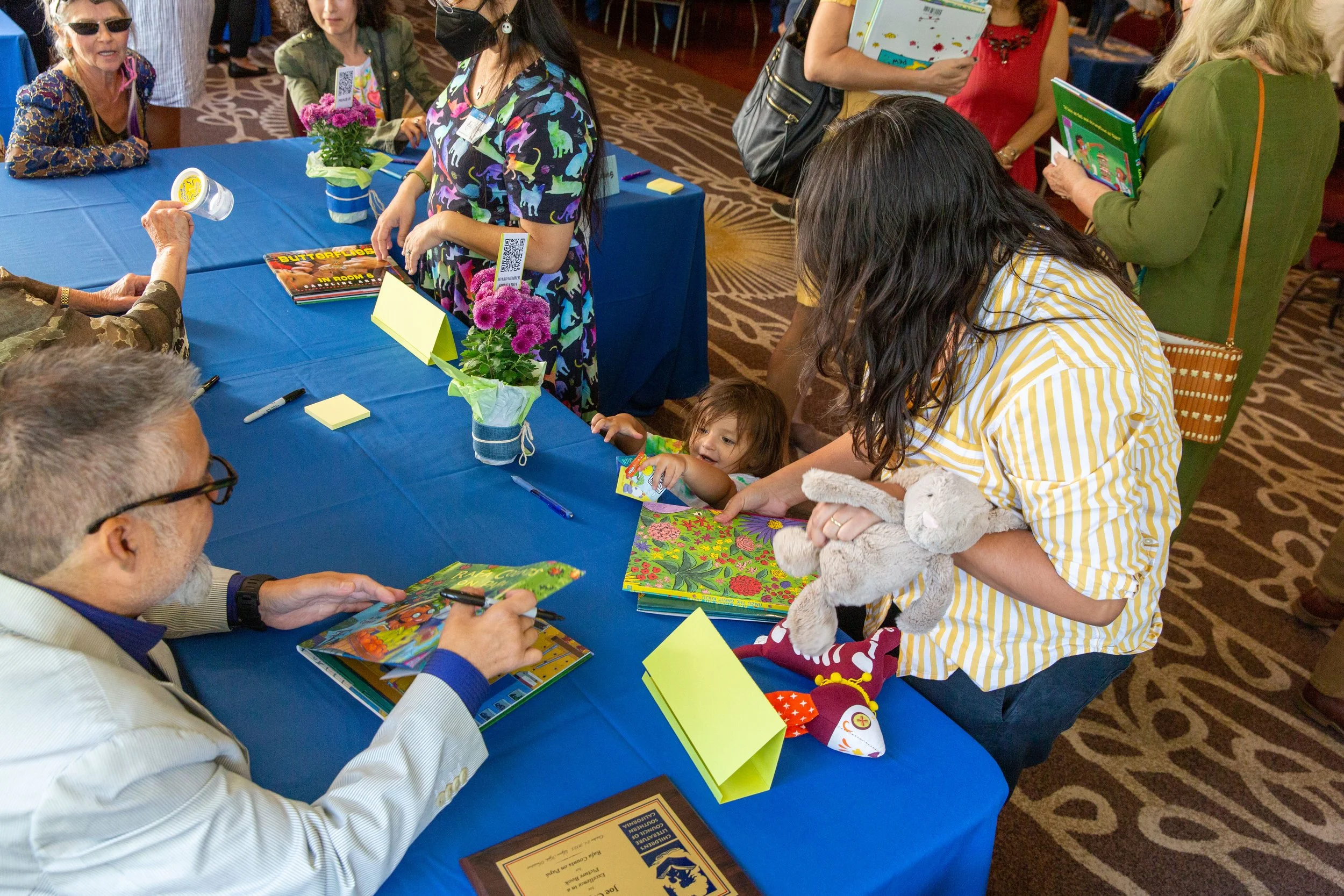 Author/illustrator Joe Cepeda meets a young reader at the signing table. (Josh Steichmann)