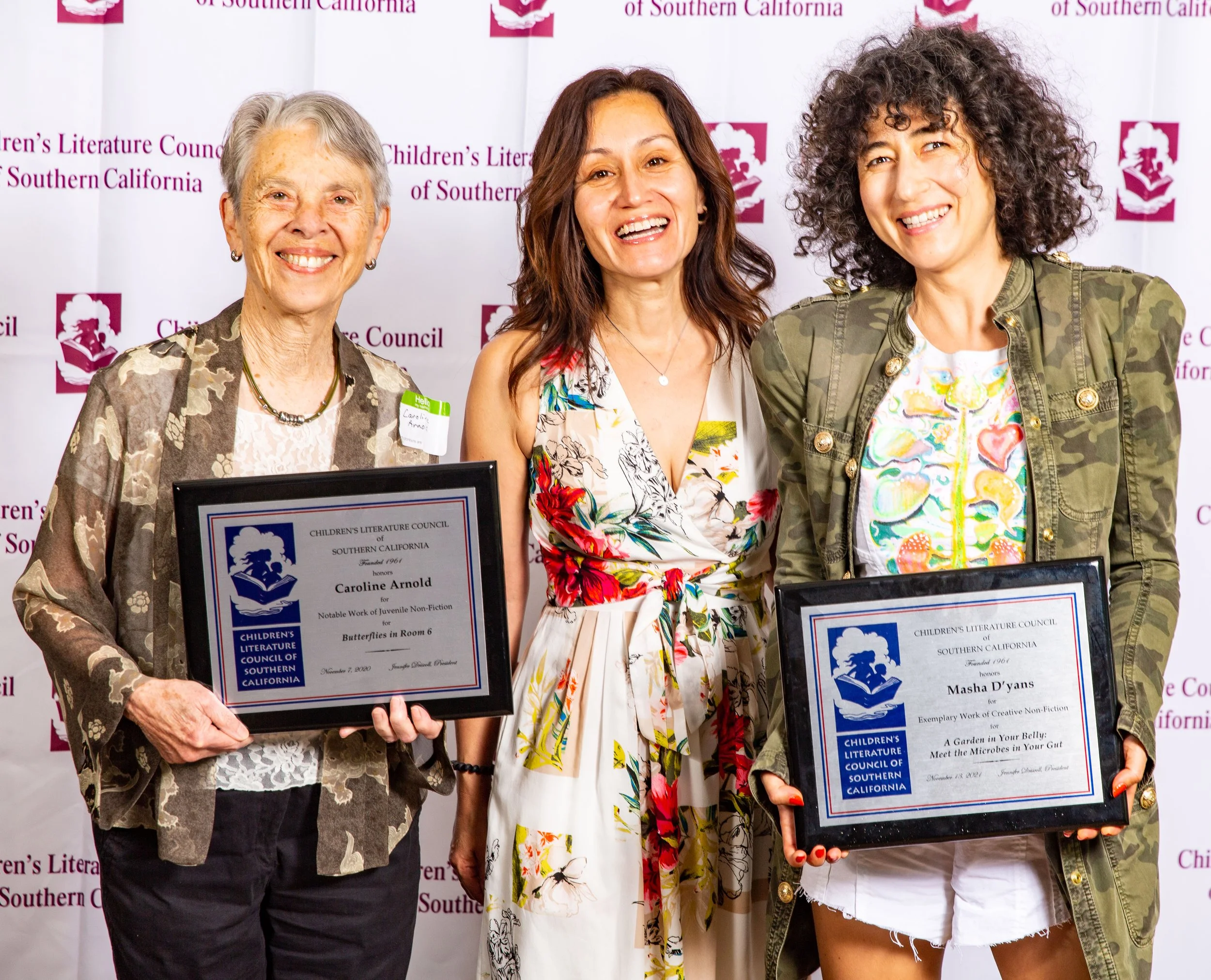 L to R: Award Winners Caroline Arnold (2020), Access Books representative Claudia Magana (standing in for Winner Dr. Rebecca Constantino, Ph.D, 2020 Dorothy C. McKenzie winner), and Masha D'yans (2021). (Josh Steichmann)