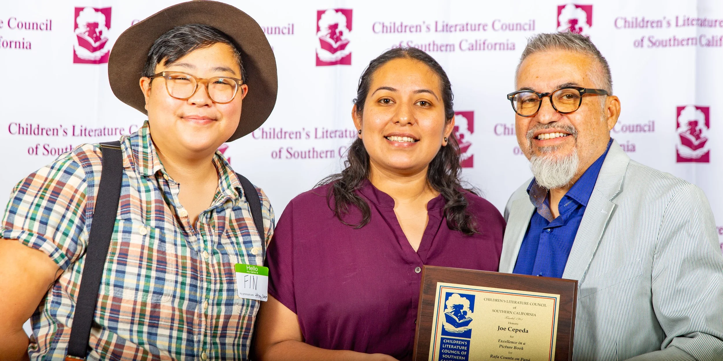 L to R: Awards Committee Chair Fin Lee, Awards Committee Member Alejandra Reyes, and Winner Joe Cepeda (Josh Steichmann)