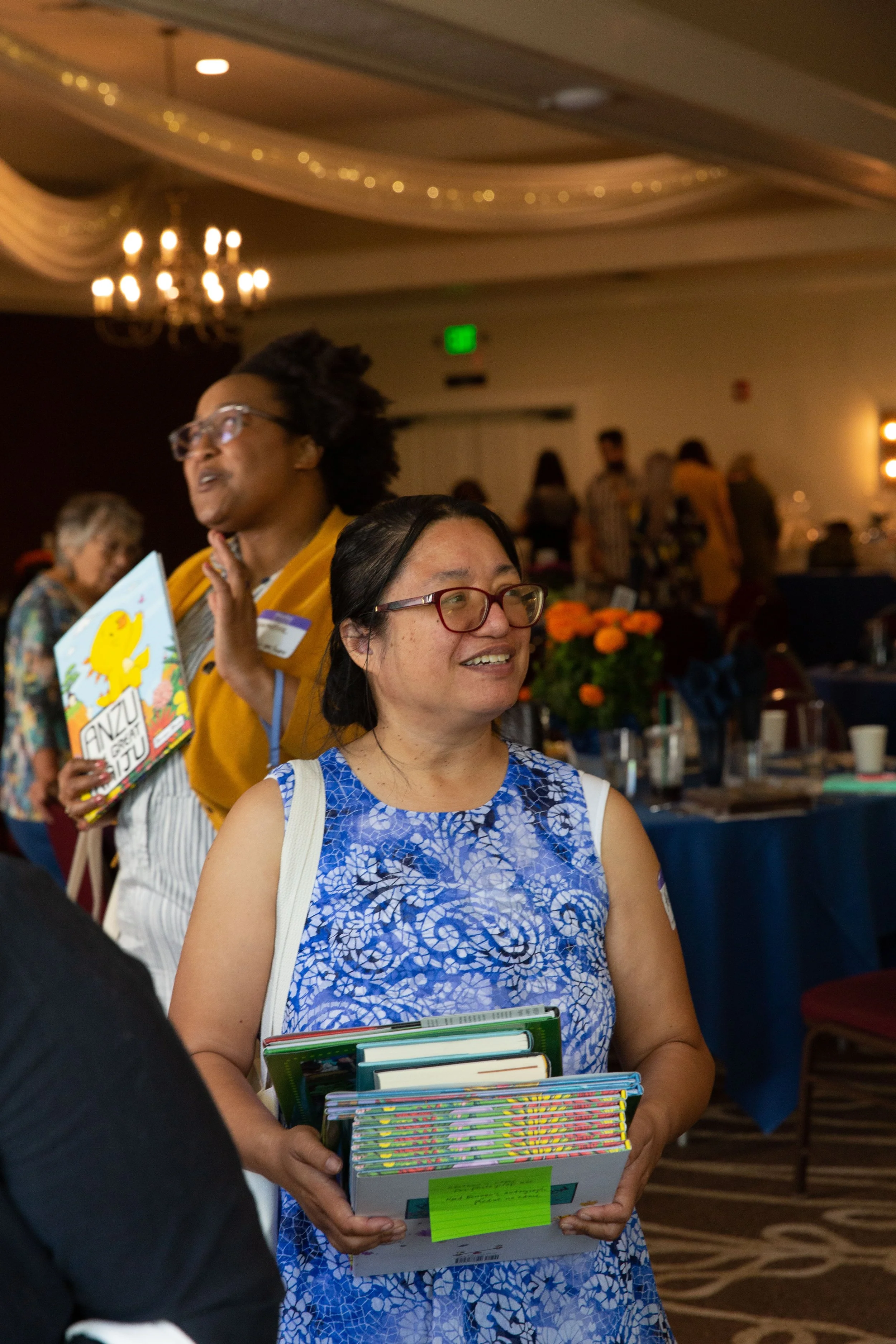 L to R: CLCSC Board Member Charmetria Marshall and Awards Committee Member Helen Fairman wait in line at the signing table. (Josh Steichmann)