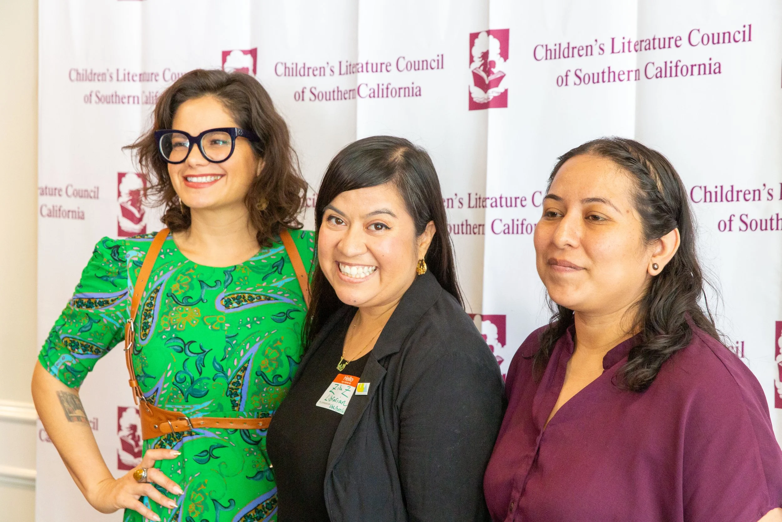 Three LAPL librarians pose for a photo in front of the CLCSC backdrop. (Josh Steichmann)