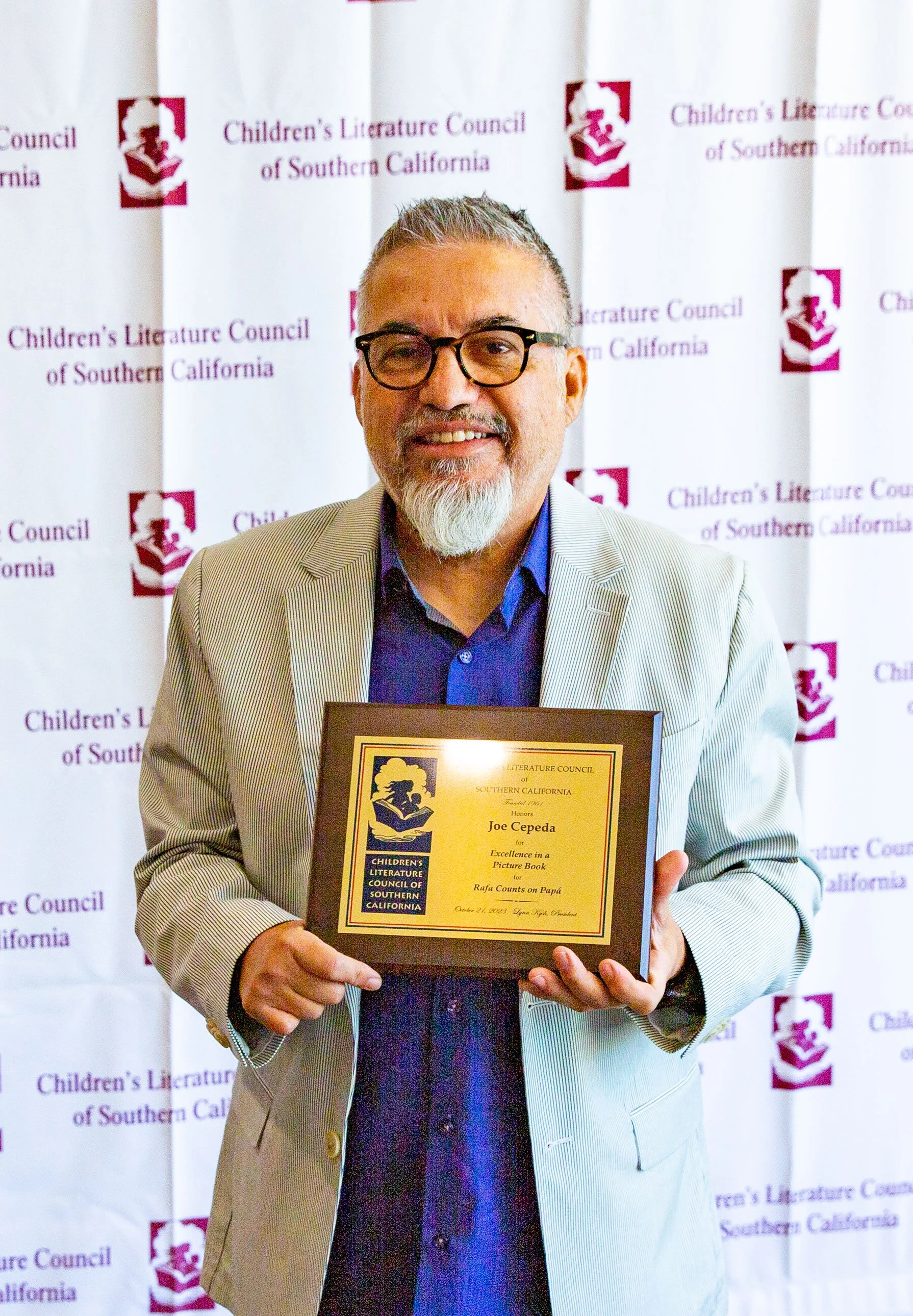 Winner Joe Cepeda holds his award plaque. (Josh Steichmann)