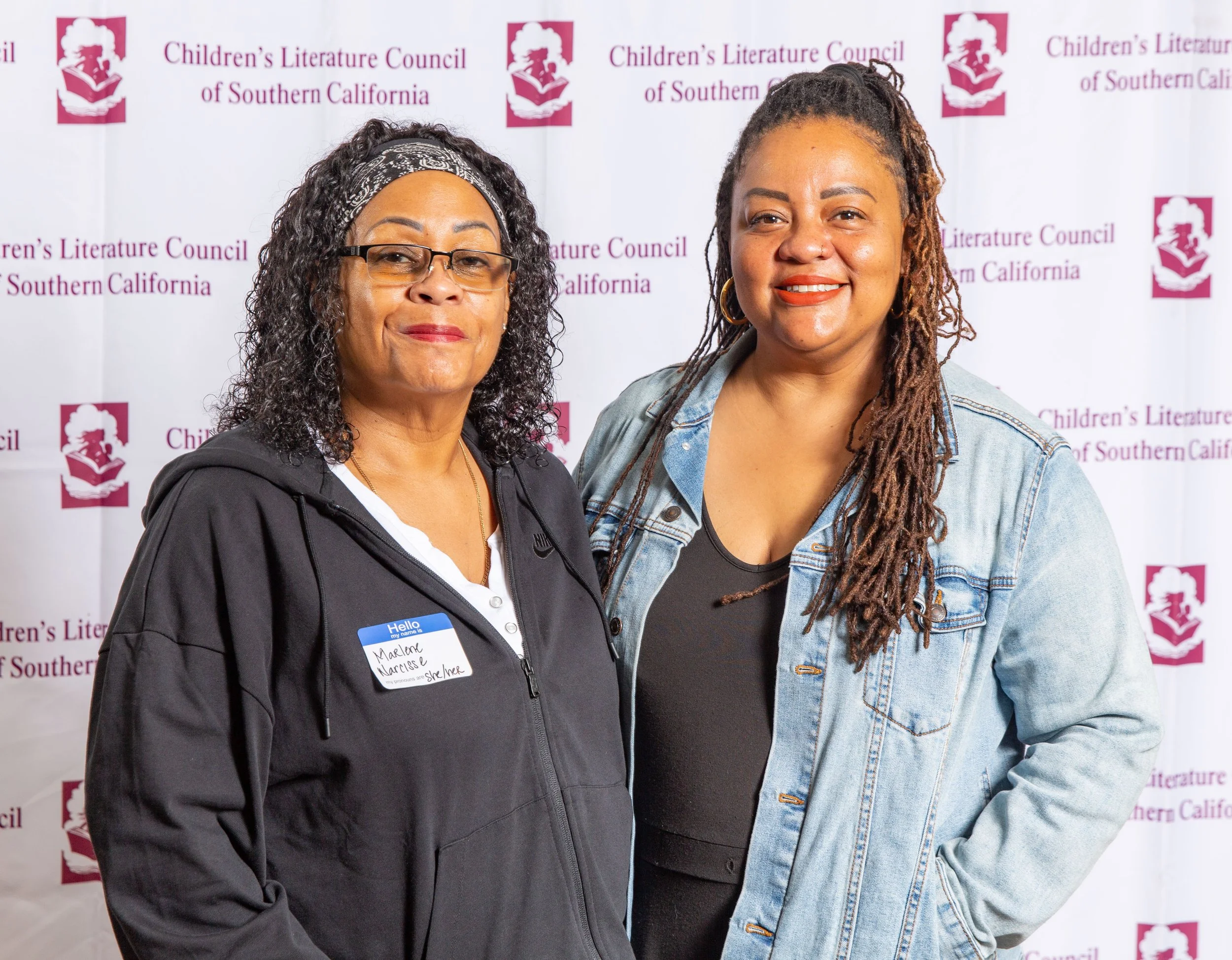 Octavia's Bookshelf founder and owner Nikki High (right) is the 2023 CLCSC winner of the Dorothy C. McKenzie Award for Distinguished  Service to the Field of Children's Literature. On the left is her mother, Marlene Narcisse. (Josh Steichmann)