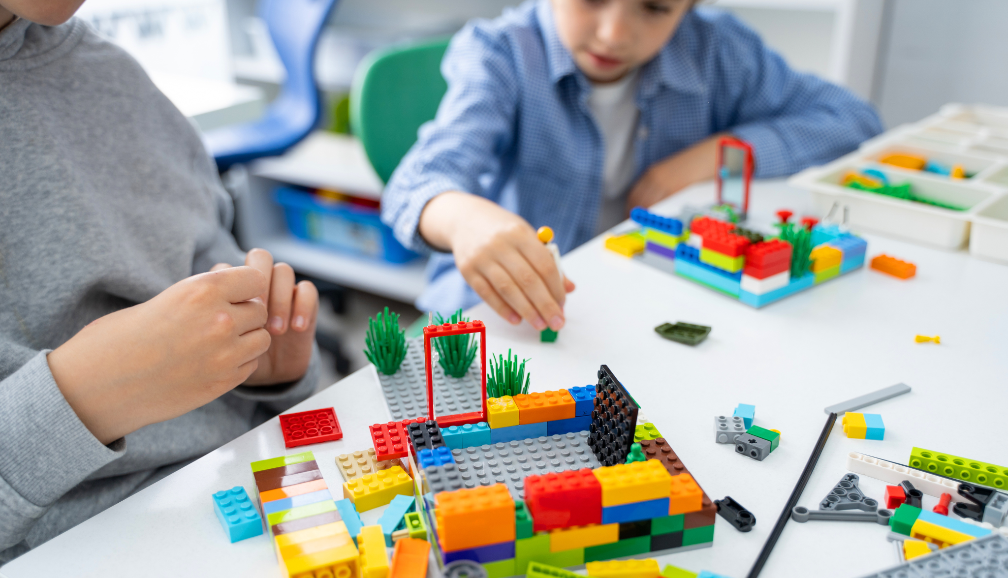 Child playing with Lego as part of group therapy.