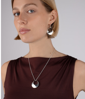 Model wearing Round Open Twist Silver Pendant.png