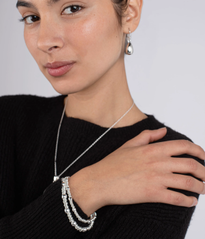 Model wearing slinky ball and ring bracelet.png