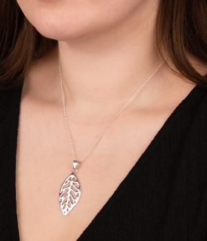 Model wearing Andea Sculptured Leaf Silver Pendant.png