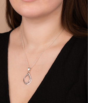 Model wearing Andea Open Teardrop Silver Pendant.png