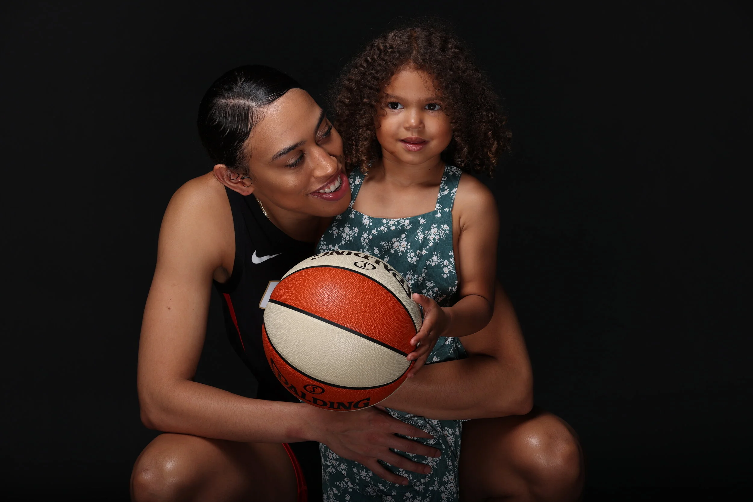 Las Vegas Aces star Dearica Hamby and daughter Amaya have become recognizable among WNBA fans worldwide. (Photo courtesy Las Vegas Aces, via Getty Images)