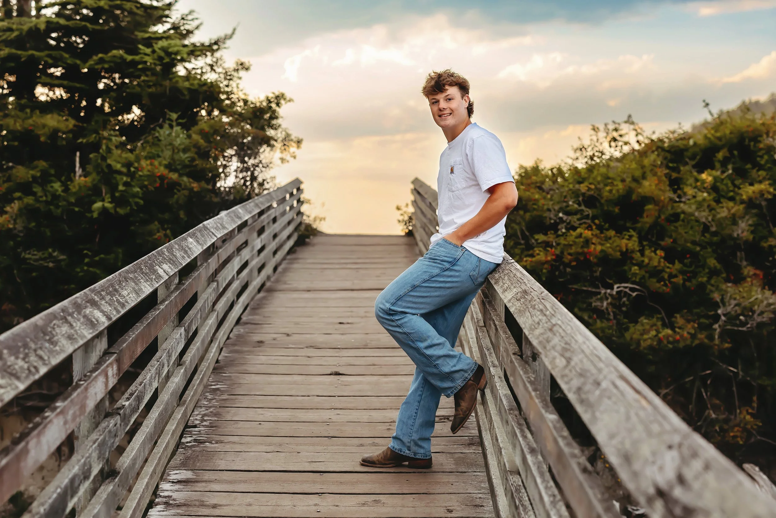 Jake standing on dock at the beach for Summer High School Senior Session at Rosario Beach Anacortes WA