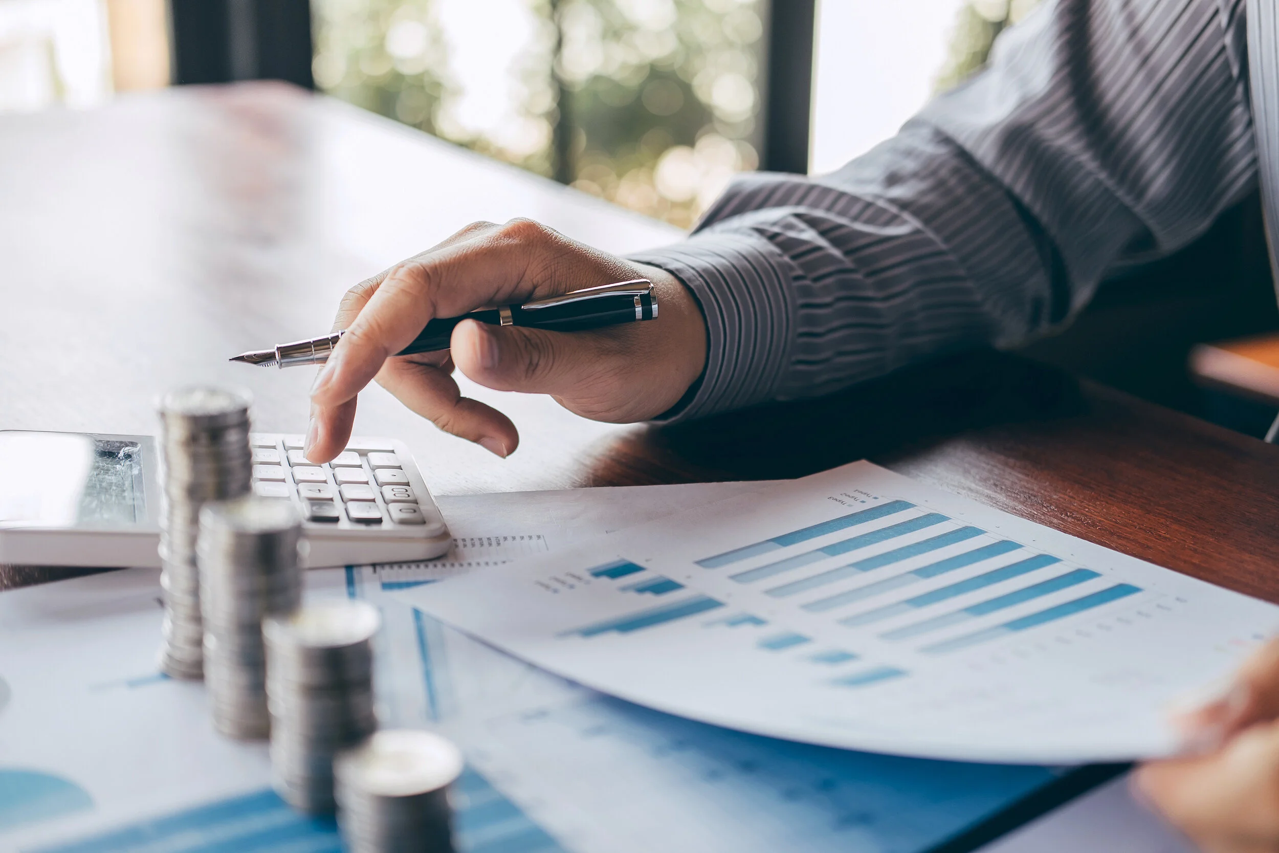 bigstock-Businessman-Accountant-Countin-304795969.jpg