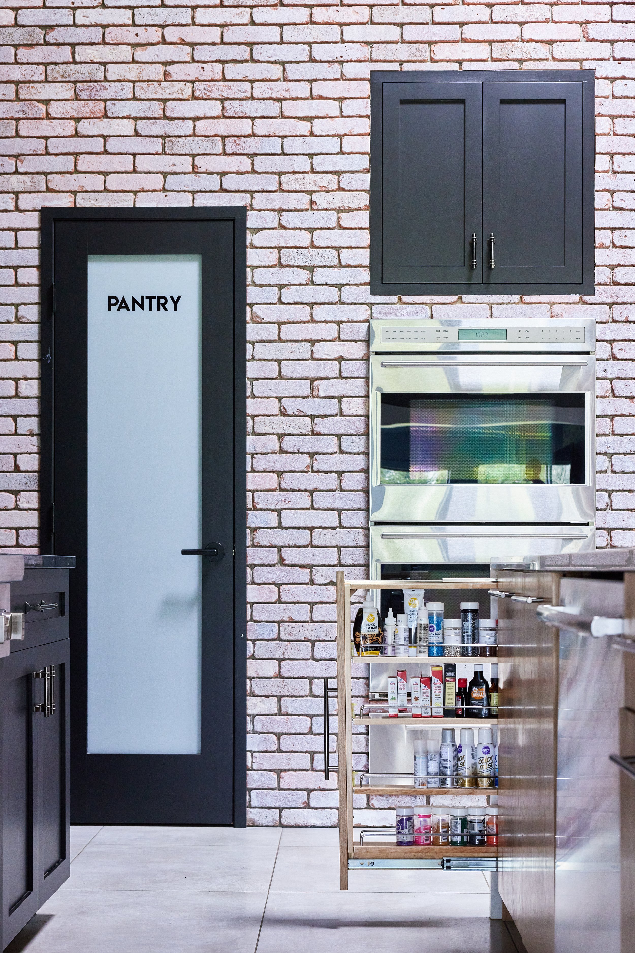 Chris ODell's House Kitchen Vertical Pantry Door Brick Wall.jpg