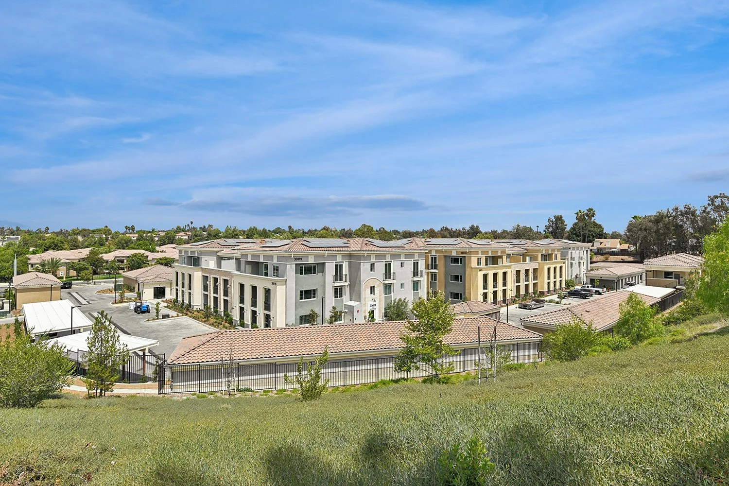 View from above overlooking Rendezvous Phase II highlighting the unique and beautiful architecture, and lush greenery within and surrounded the community. 