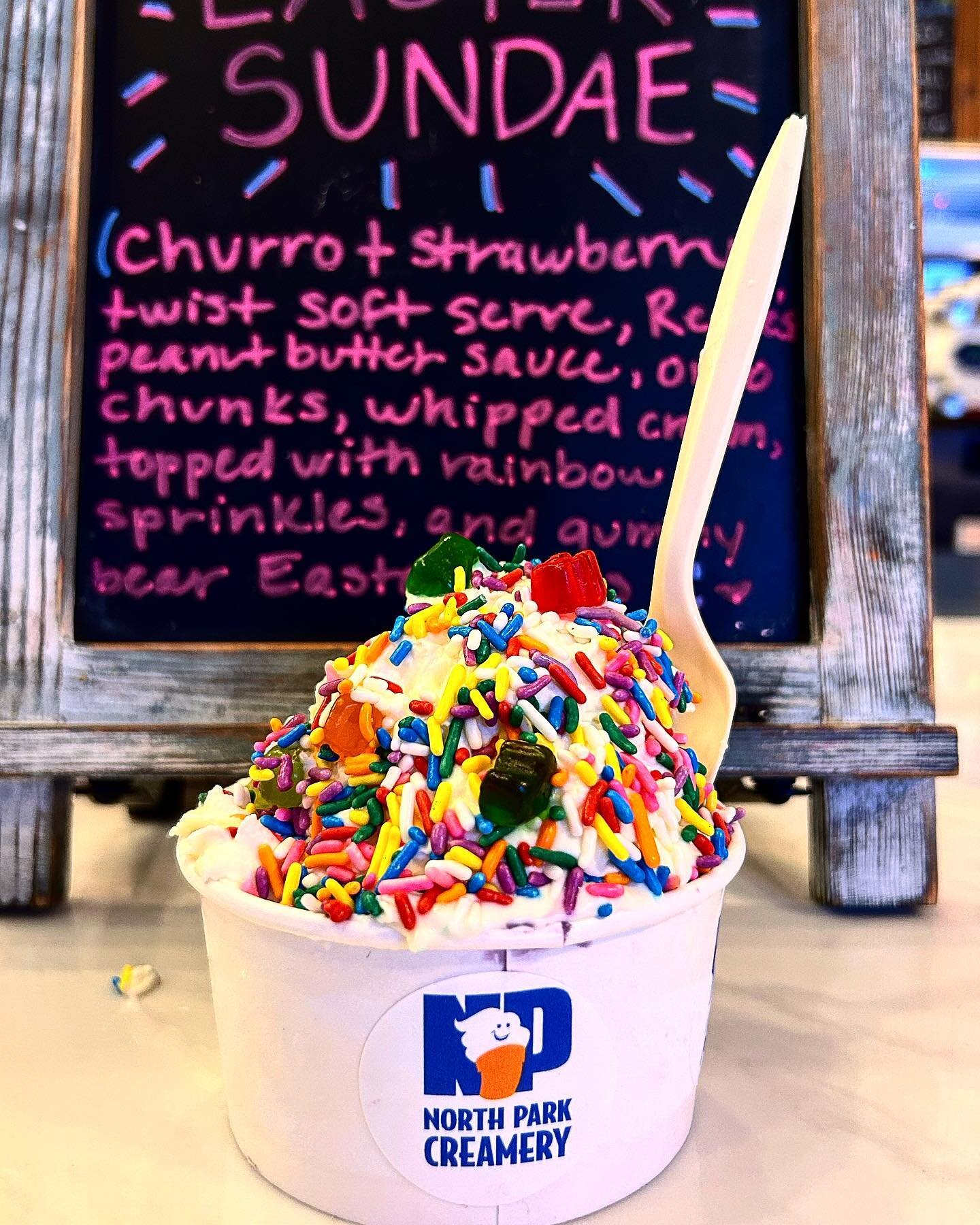 🚨New limited edition special🚨the Easter Sundae😹🐣. This delicious sundae includes: Organic Churro and strawberry 🍓 twist soft serve, Reese peanut butter 🥜 sauce, Oreos, and is topped with delicious organic whipped cream, sprinkles, and hidden🤫 