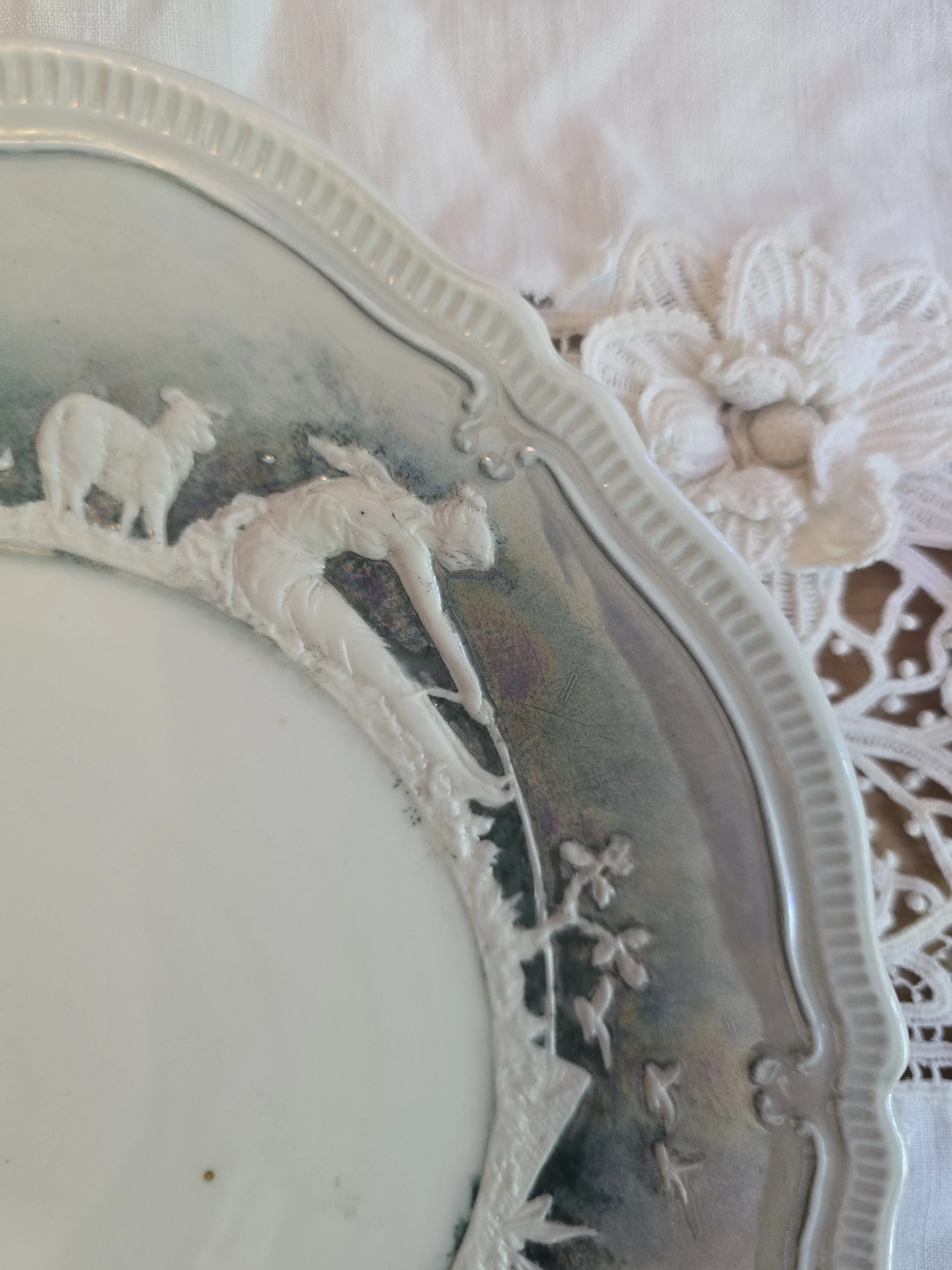 Iridescent mother of pearl glaze detail on vintage German decorative plate