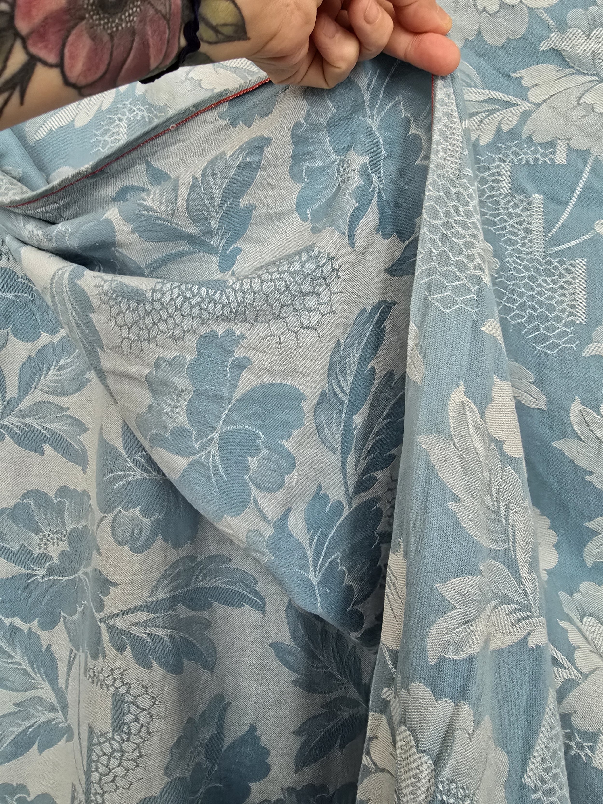 Hanging shot of floral coutil fabric in natural light